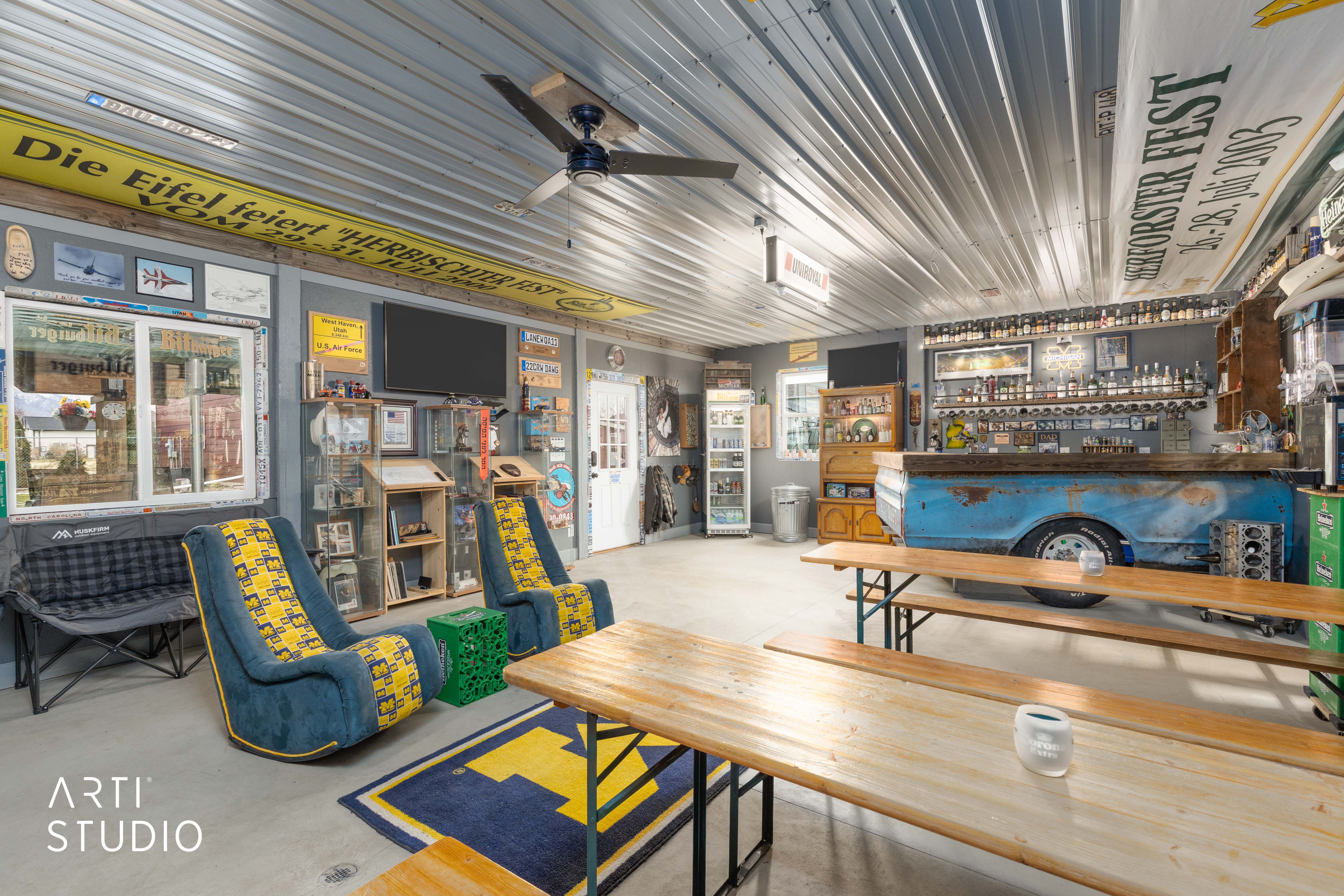Interior space featuring a corrugated metal ceiling, concrete flooring, and a built-in bar