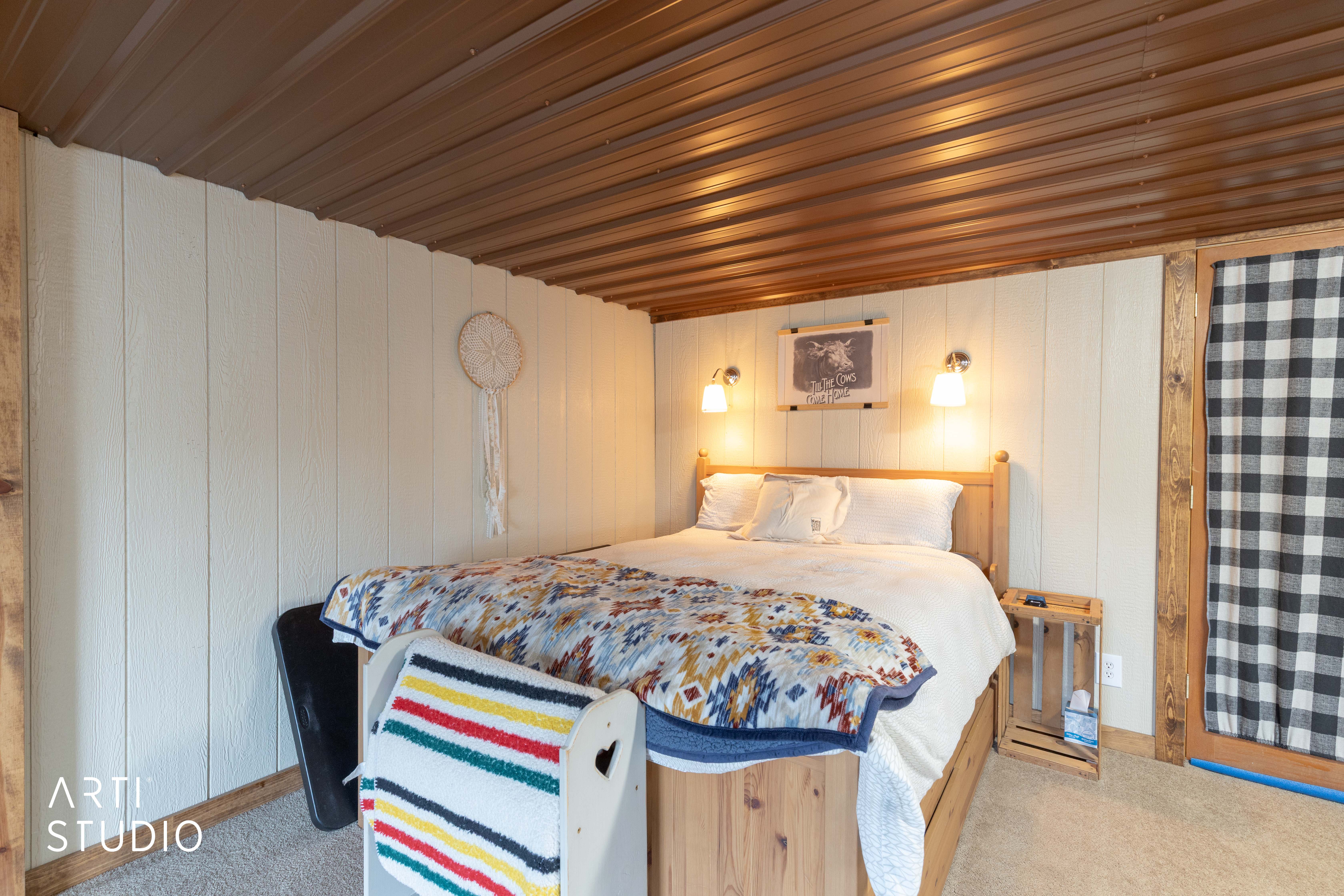 Corrugated metal ceiling paired with vertical shiplap walls