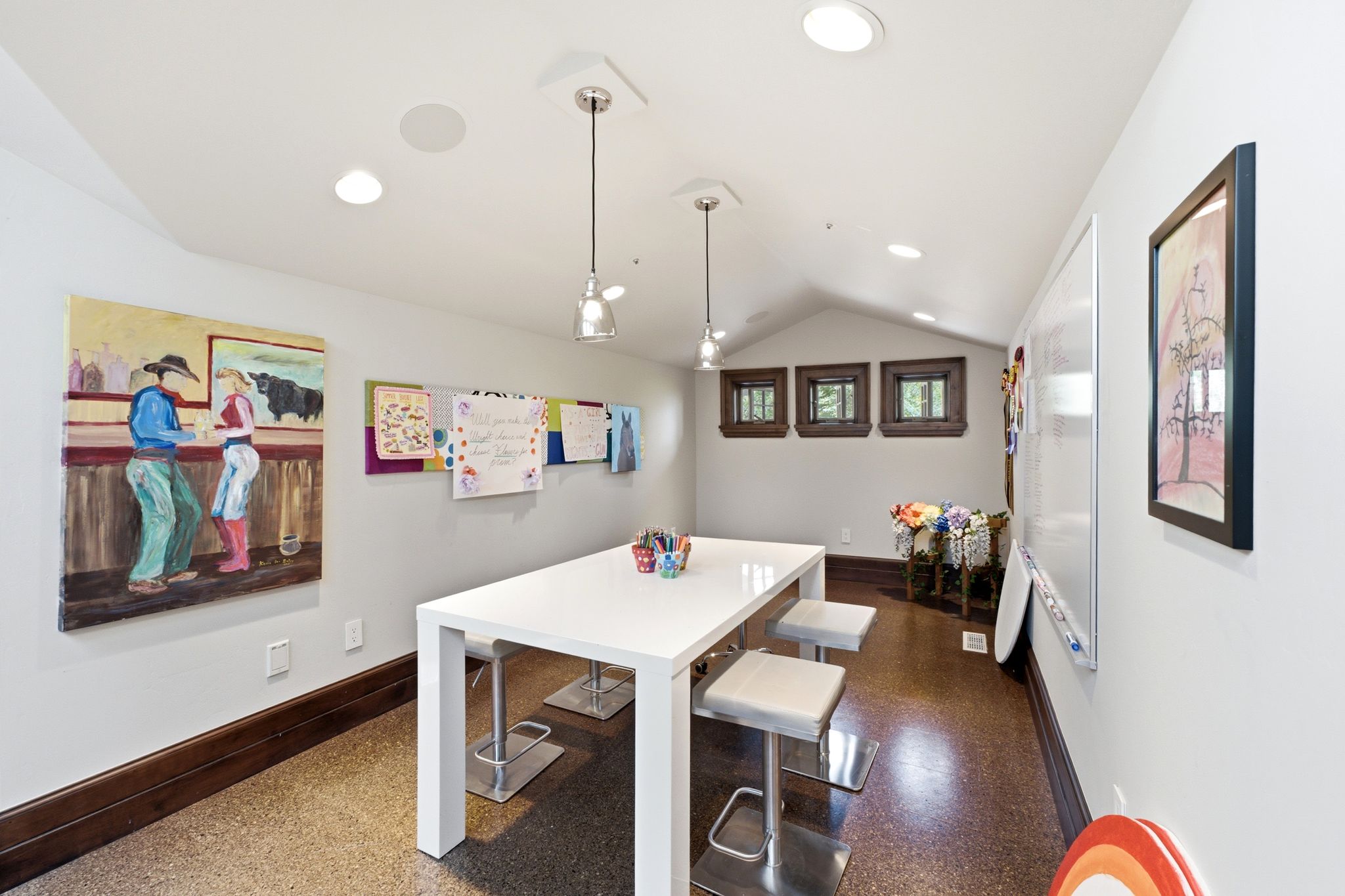 Vaulted ceiling with recessed lighting and pendant fixtures