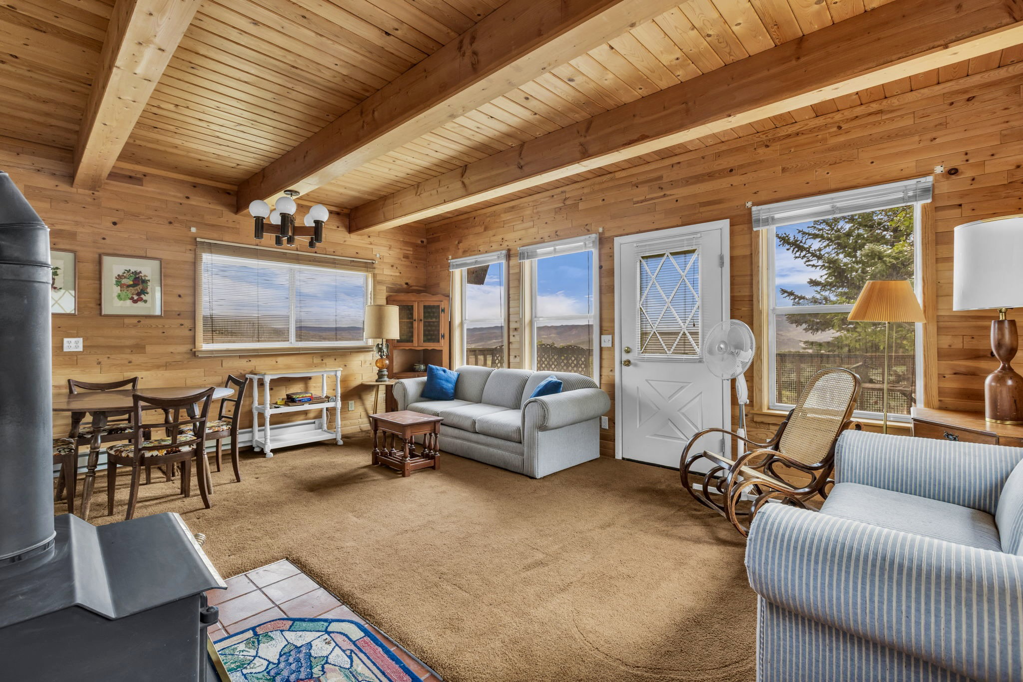 Exposed wood beams and open floor plan.