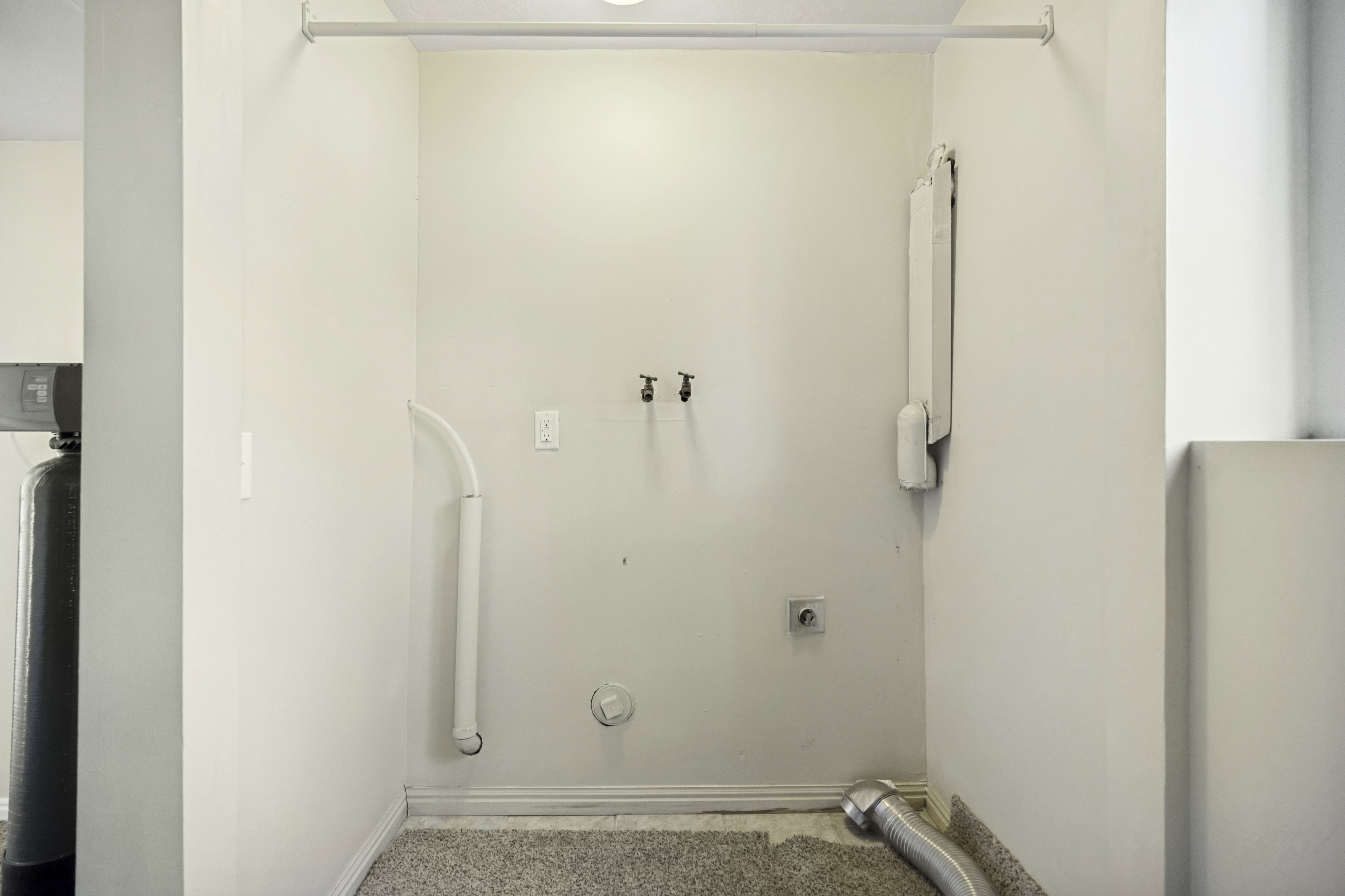 Dedicated laundry area featuring a water hookup, electrical outlet, and vent for appliances