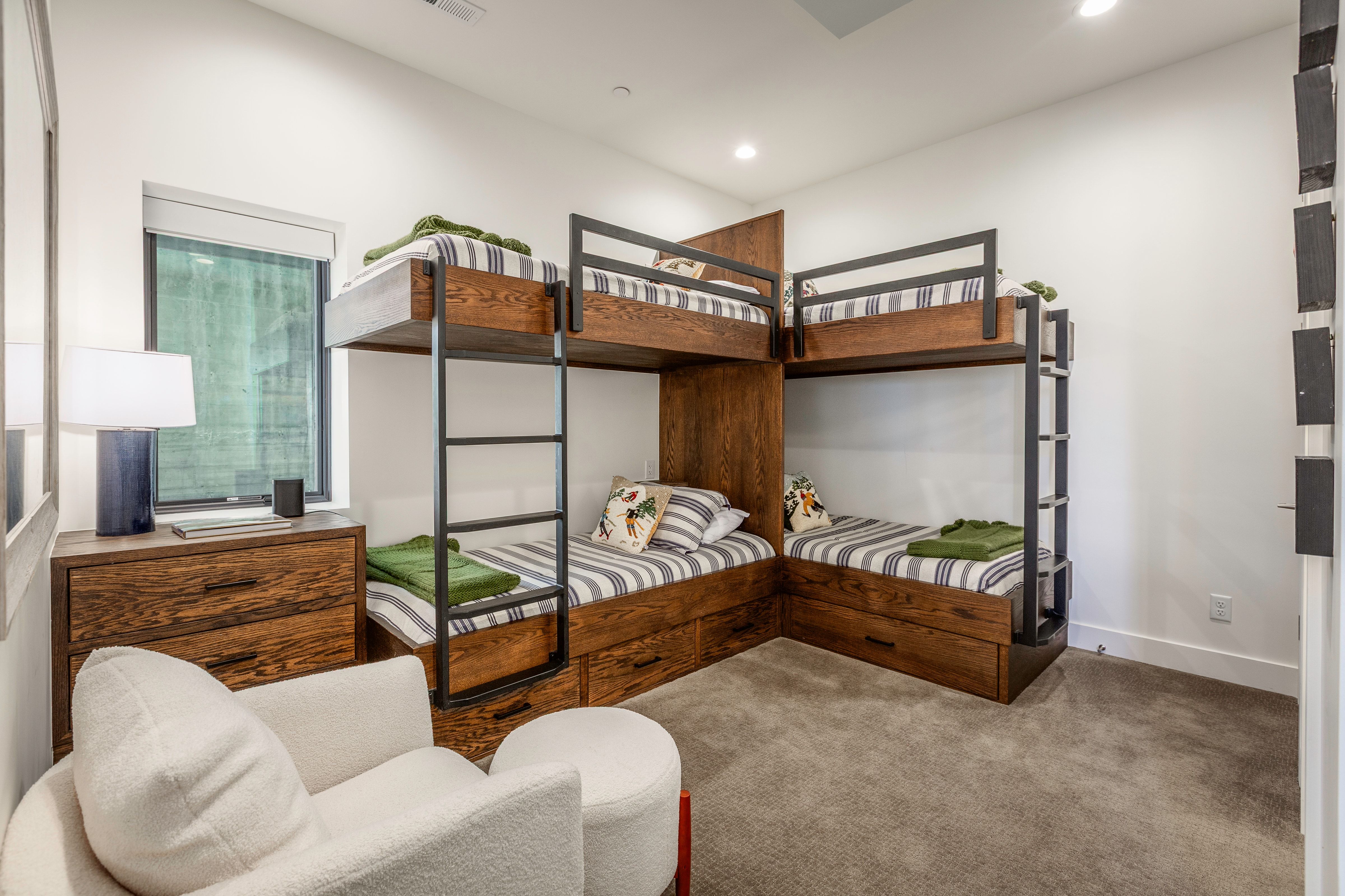 Custom-built bunk beds with integrated storage drawers