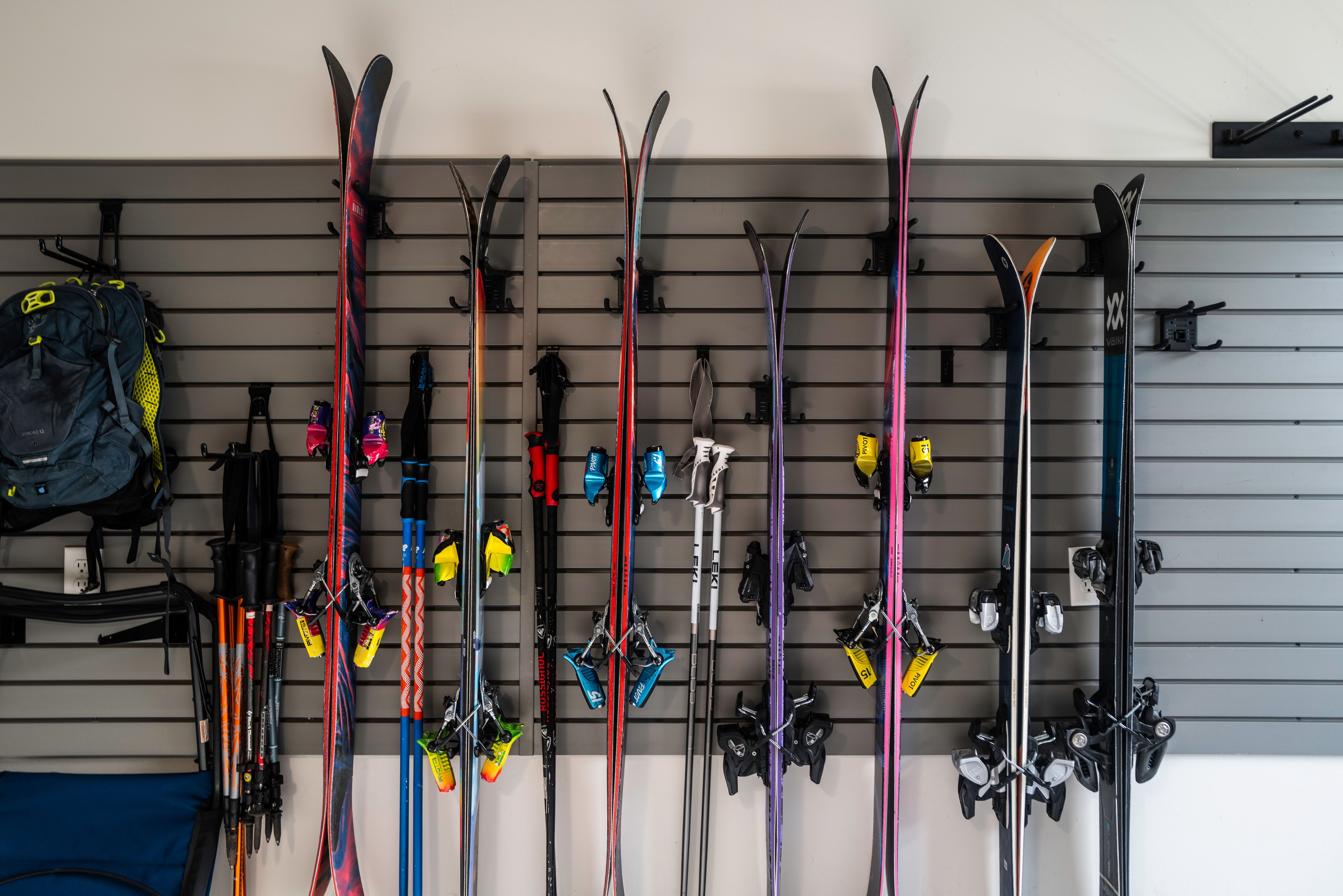 Integrated slatwall storage system with multiple hooks and shelving
