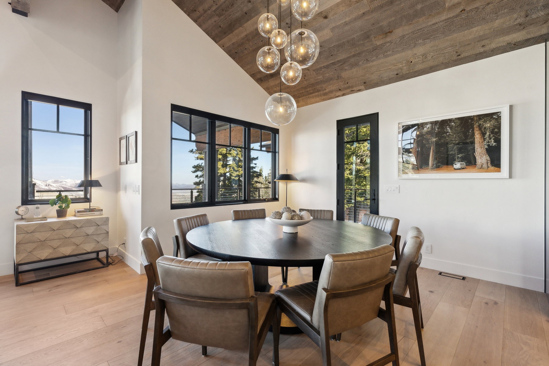 Vaulted wood-finish ceiling complementing light wood-finish flooring