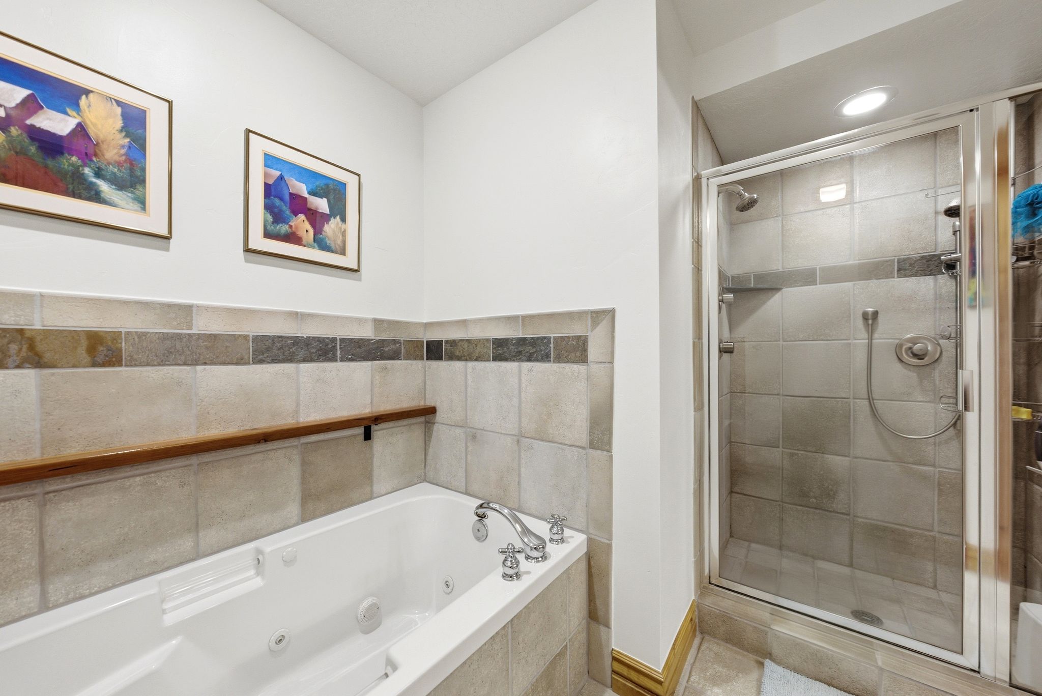 Primary Suite, double vanity, walk-in closet and separate tub and shower