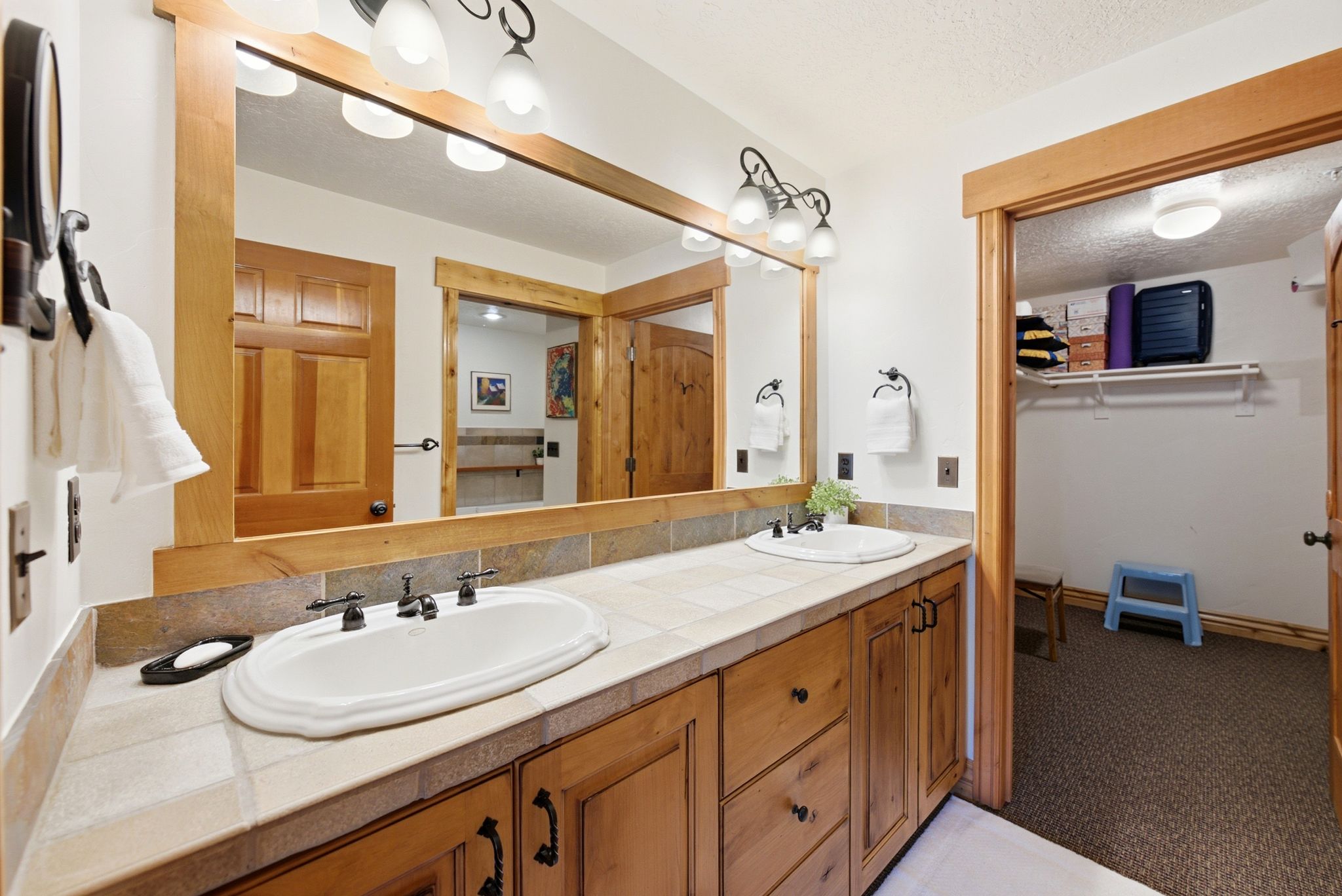 Primary Suite, double vanity, walk-in closet and separate tub and shower