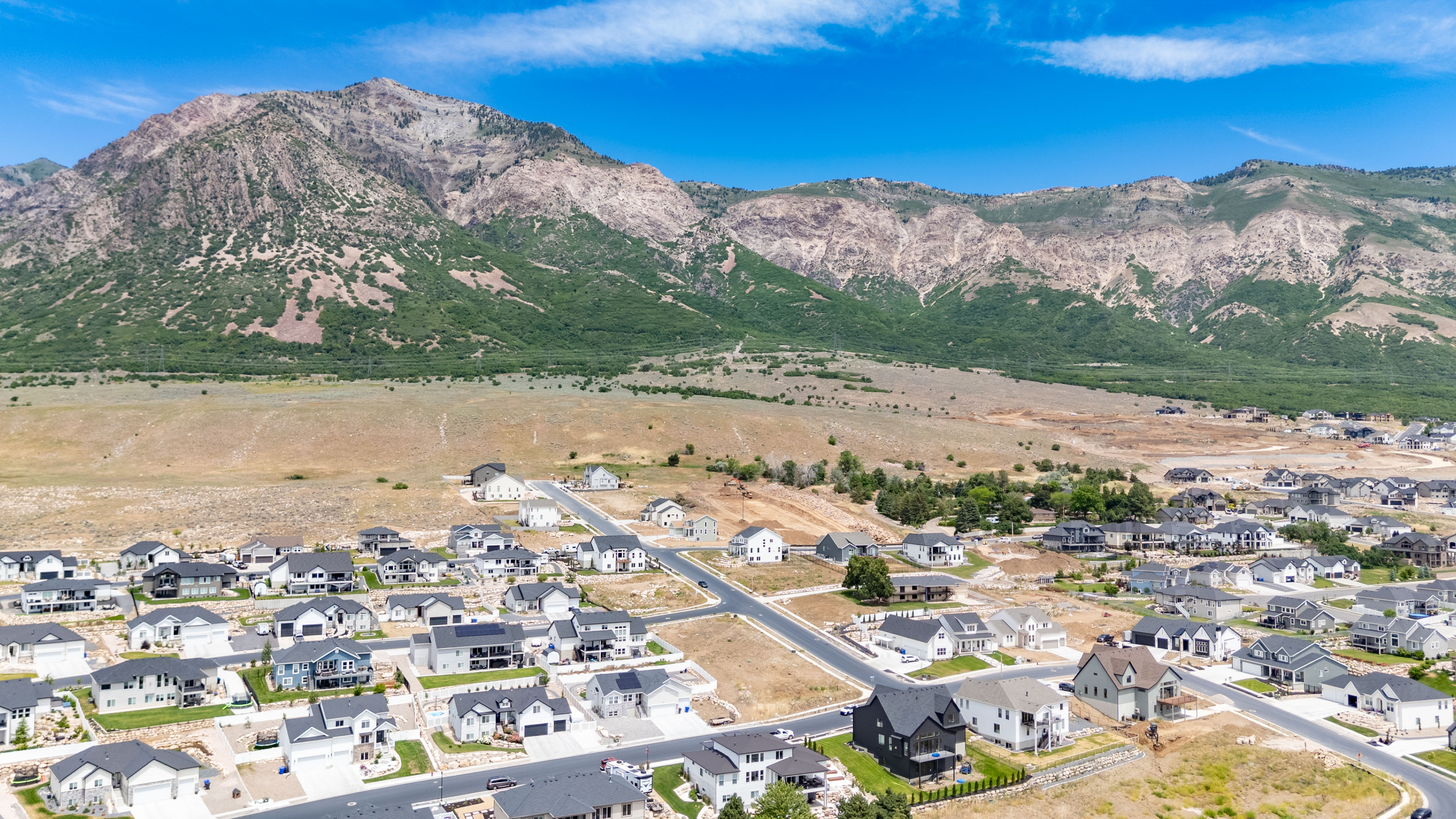 Residential development bordered by a prominent mountain range