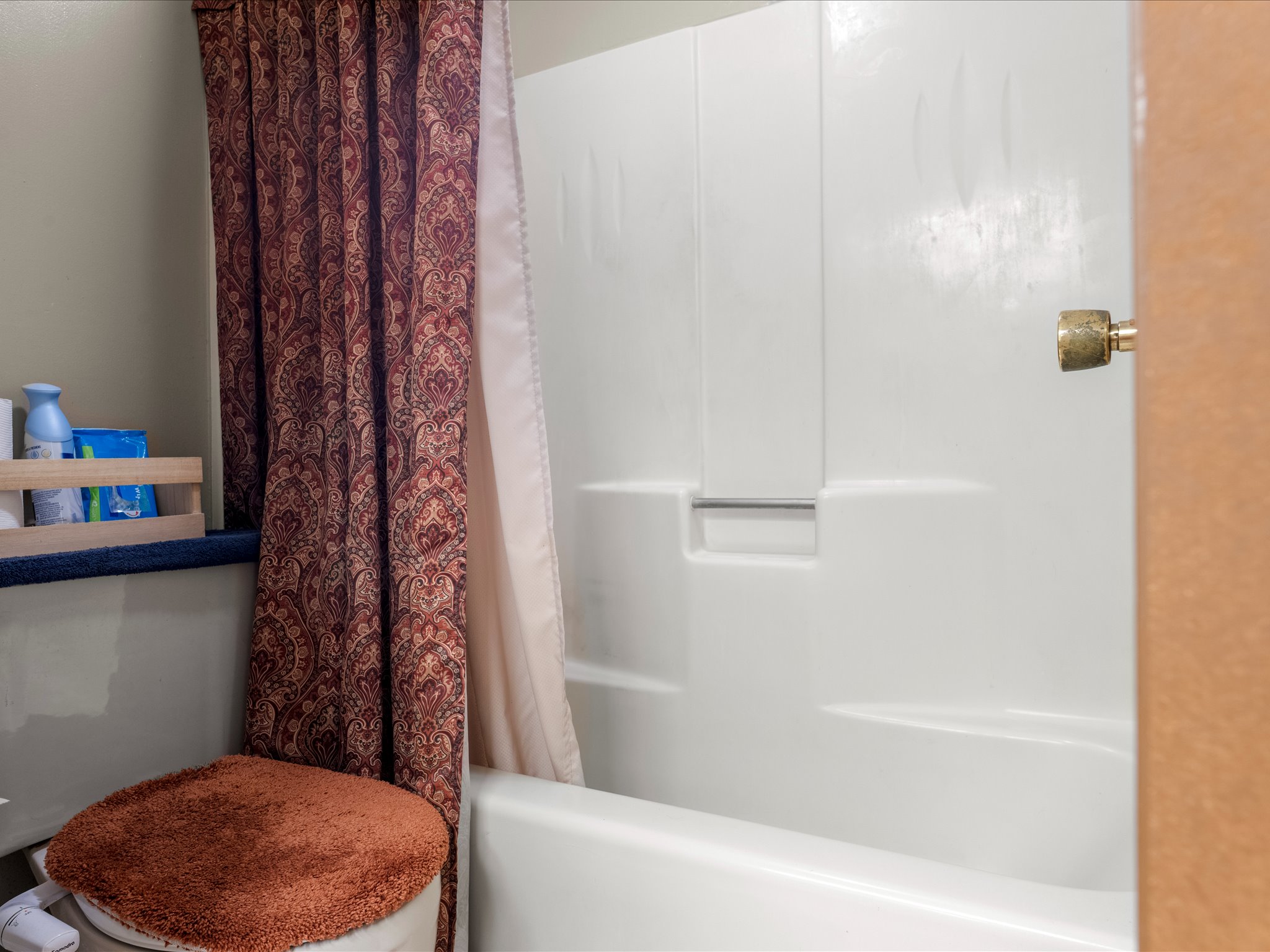 White bathtub and shower combination unit