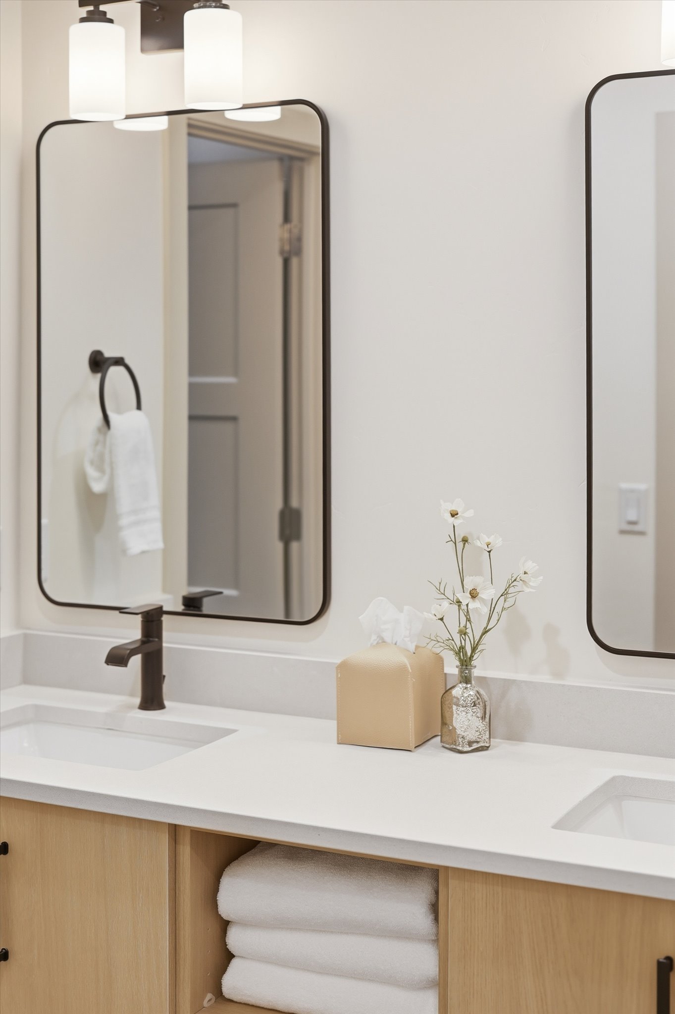 Dual vanity with stone-finish countertop and integrated rectangular sinks