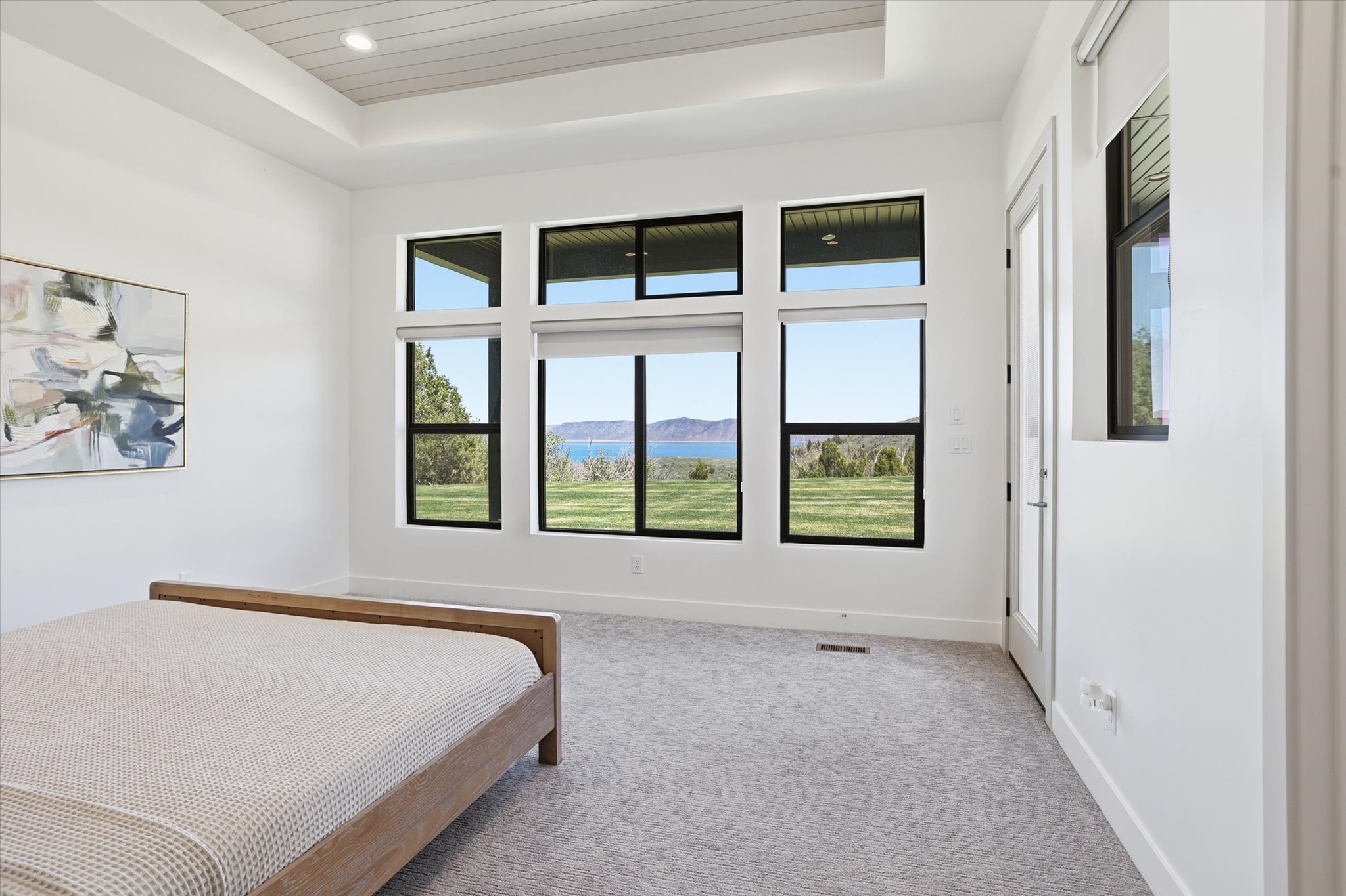 Expansive windows featuring scenic mountain and water vistas