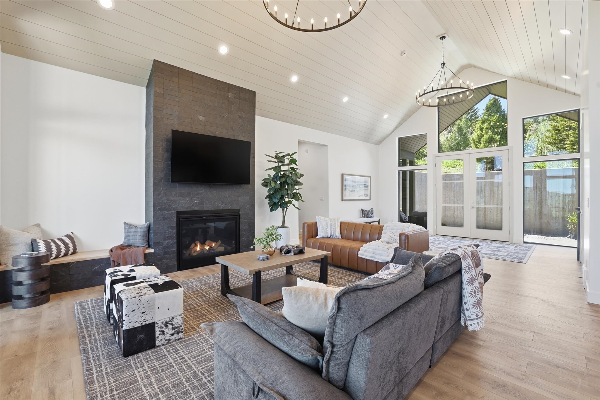 Vaulted ceilings featuring horizontal wood paneling and recessed lighting
