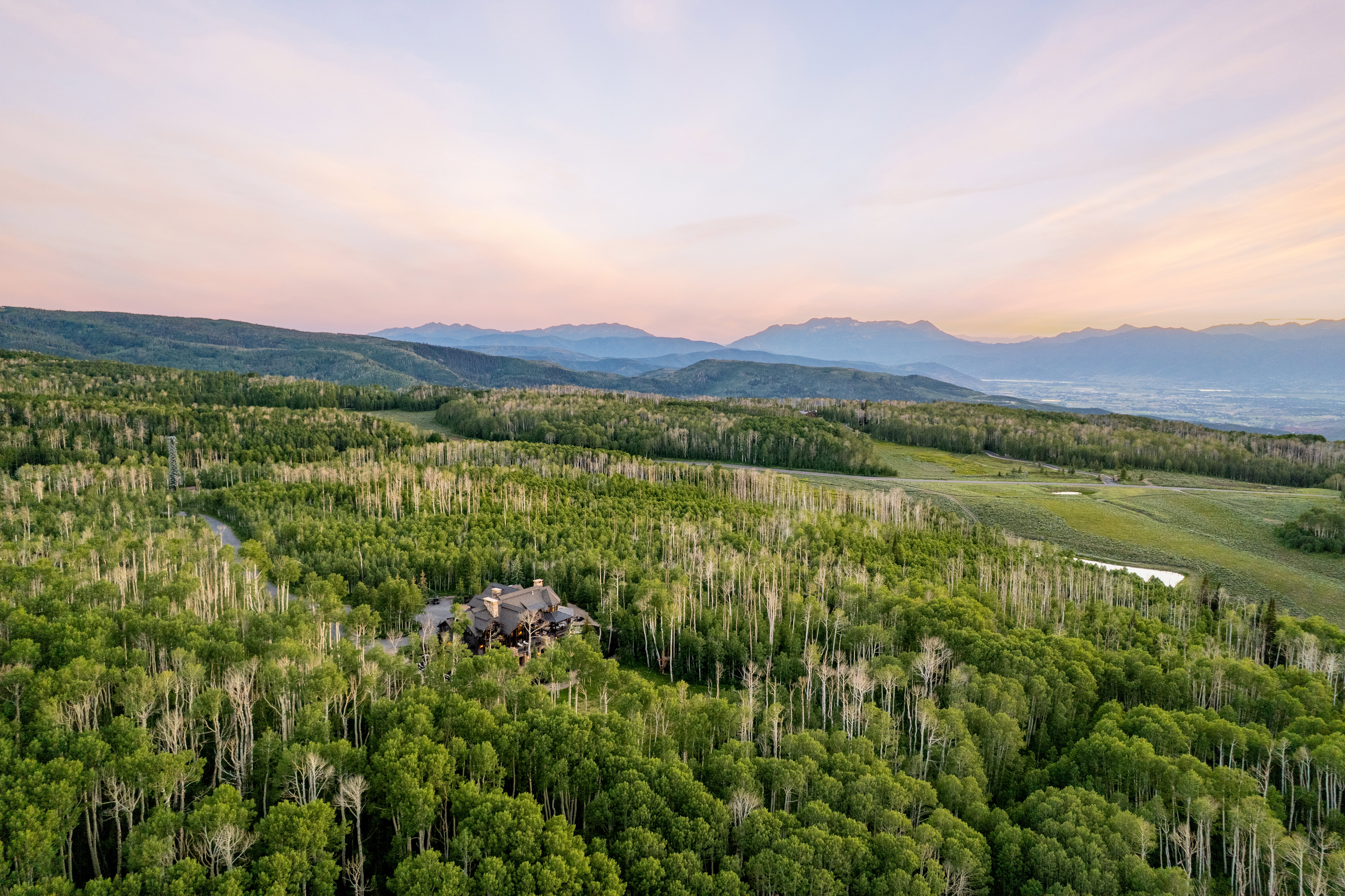 Expansive mountain estate surrounded by dense forest