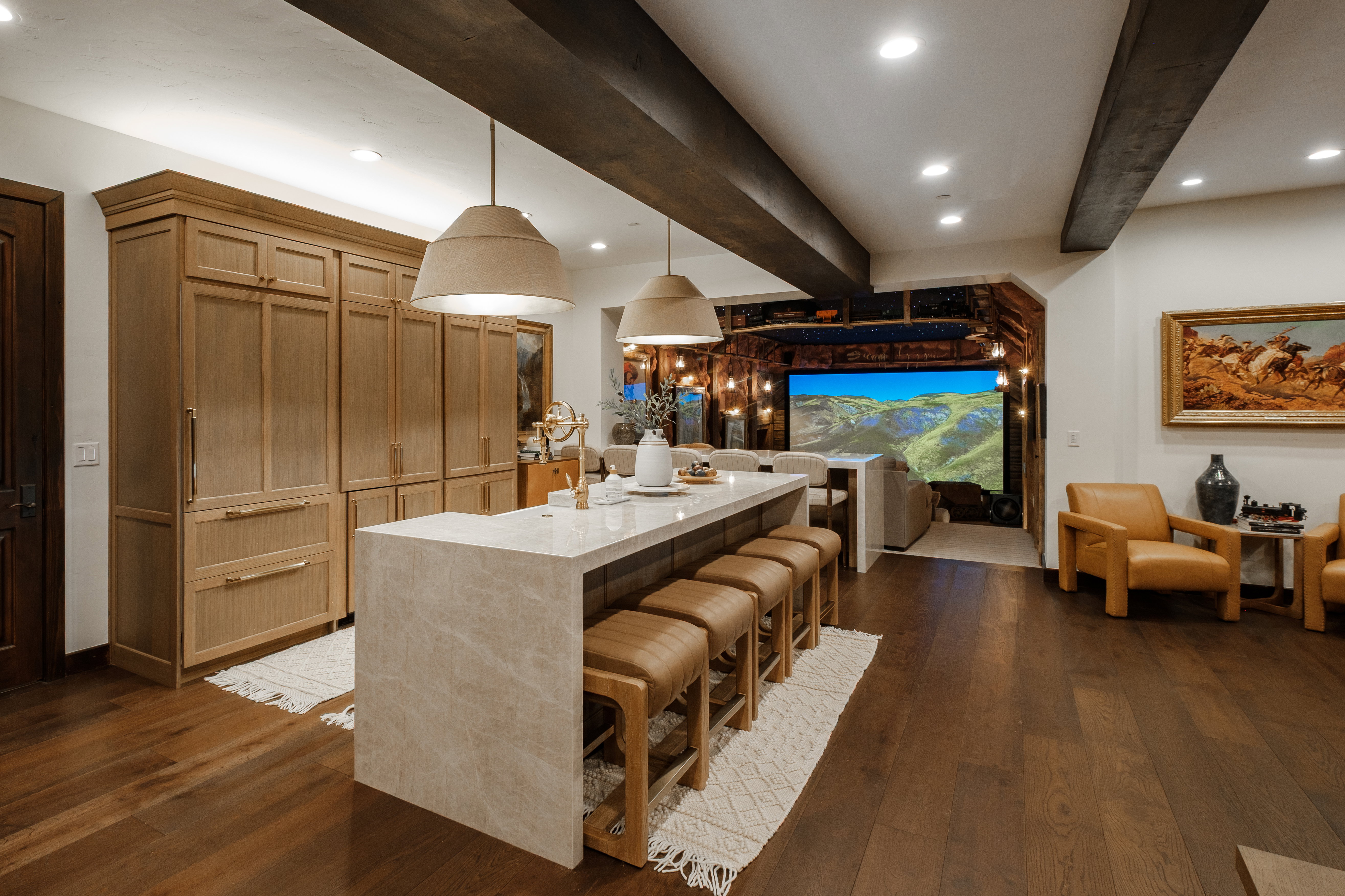 Open-concept kitchen and living area featuring dark wood-finish flooring