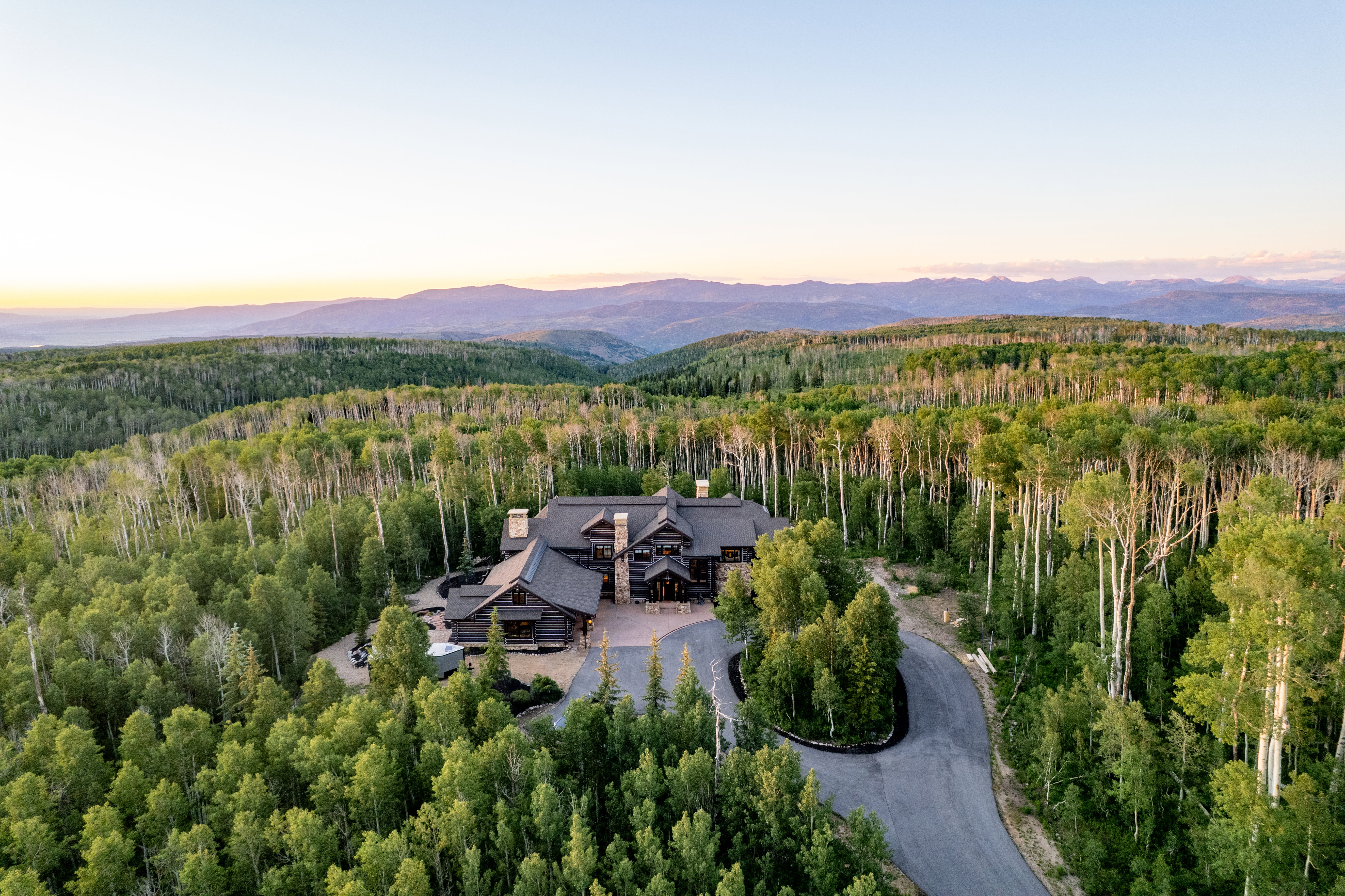 Expansive mountain estate surrounded by dense forest