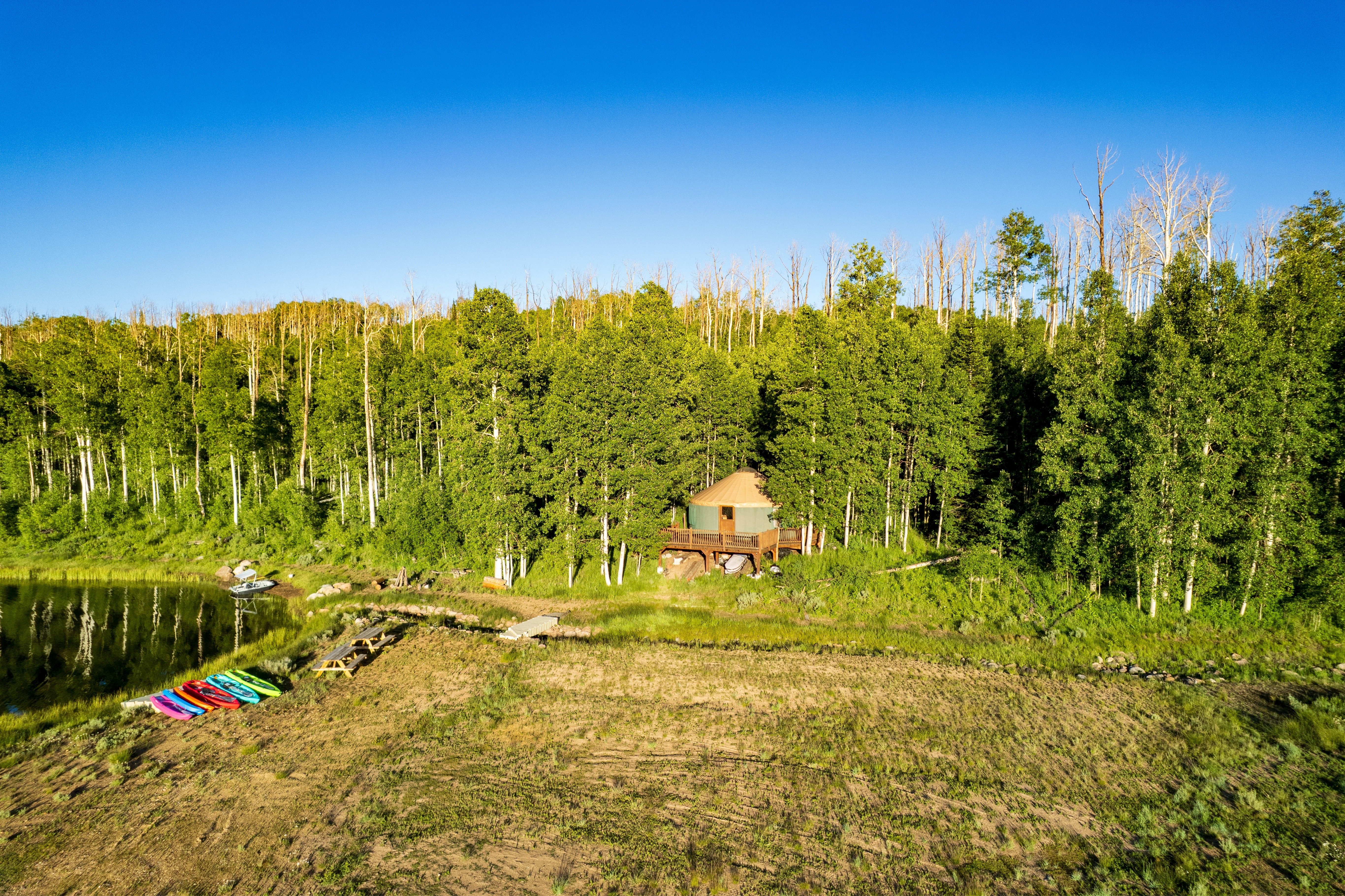 Yurt structure featuring a raised wood deck