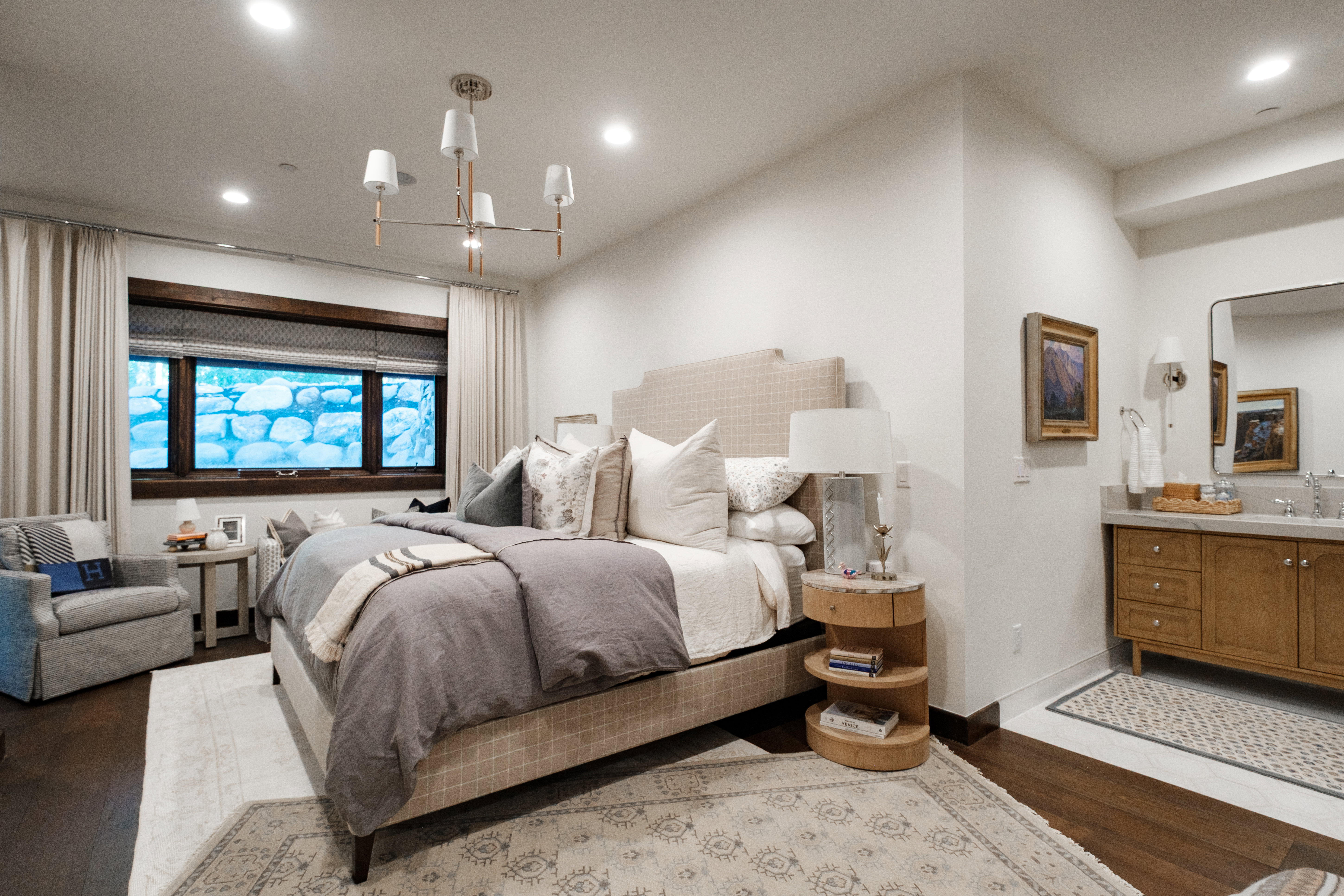 Bedroom featuring recessed lighting, dark wood-finish flooring, and a large window with wood trim