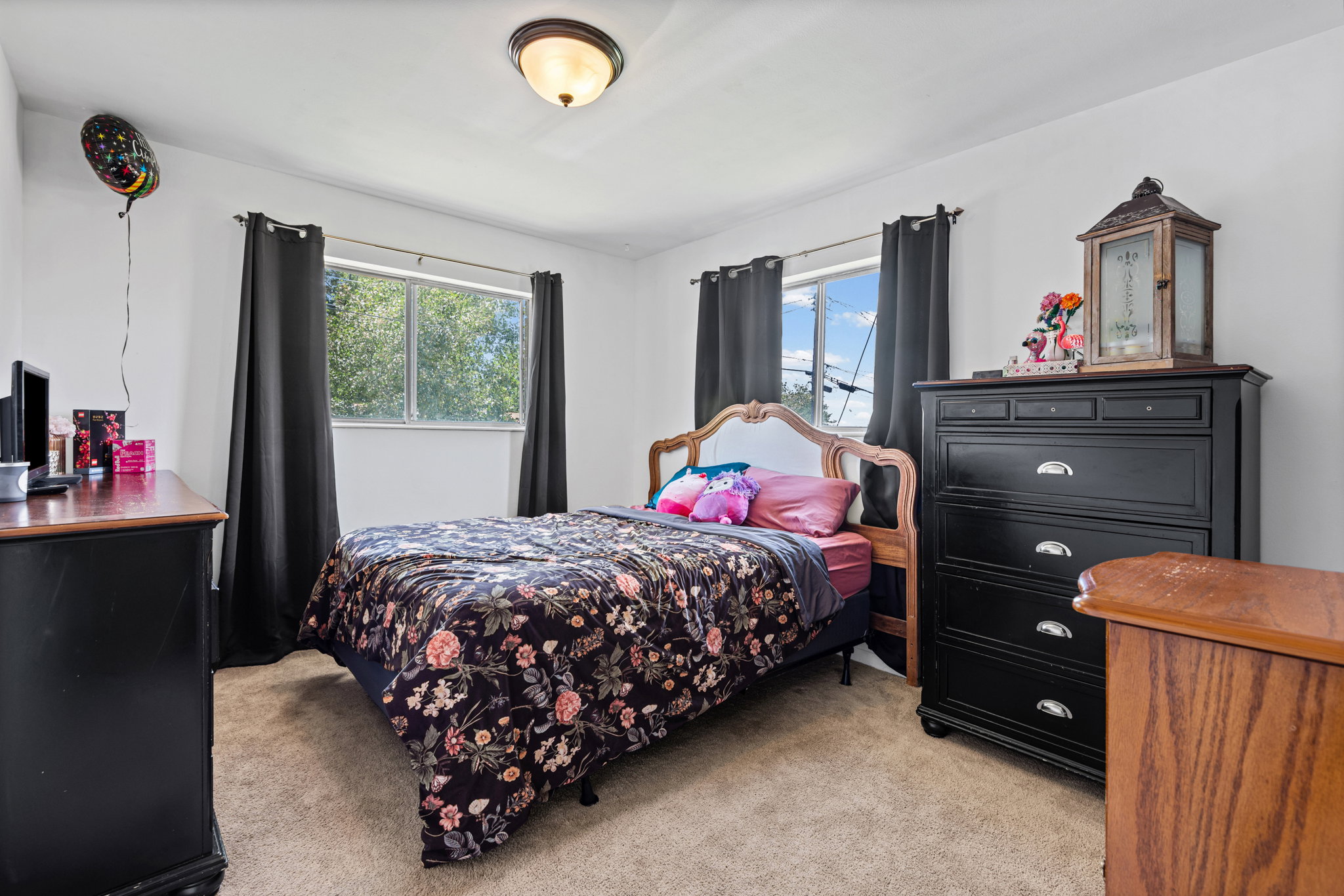 Bedroom featuring neutral-toned carpet flooring and white painted walls