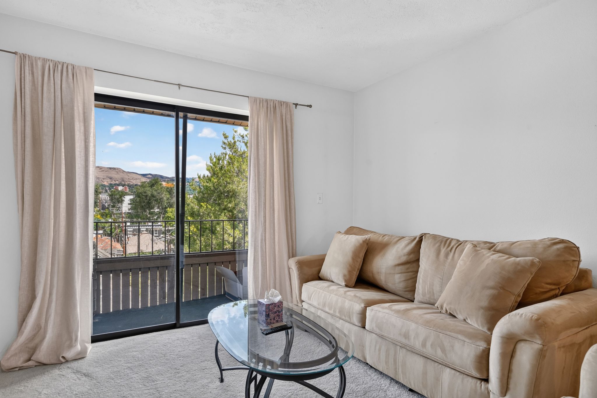 Sliding glass door opening to a private balcony