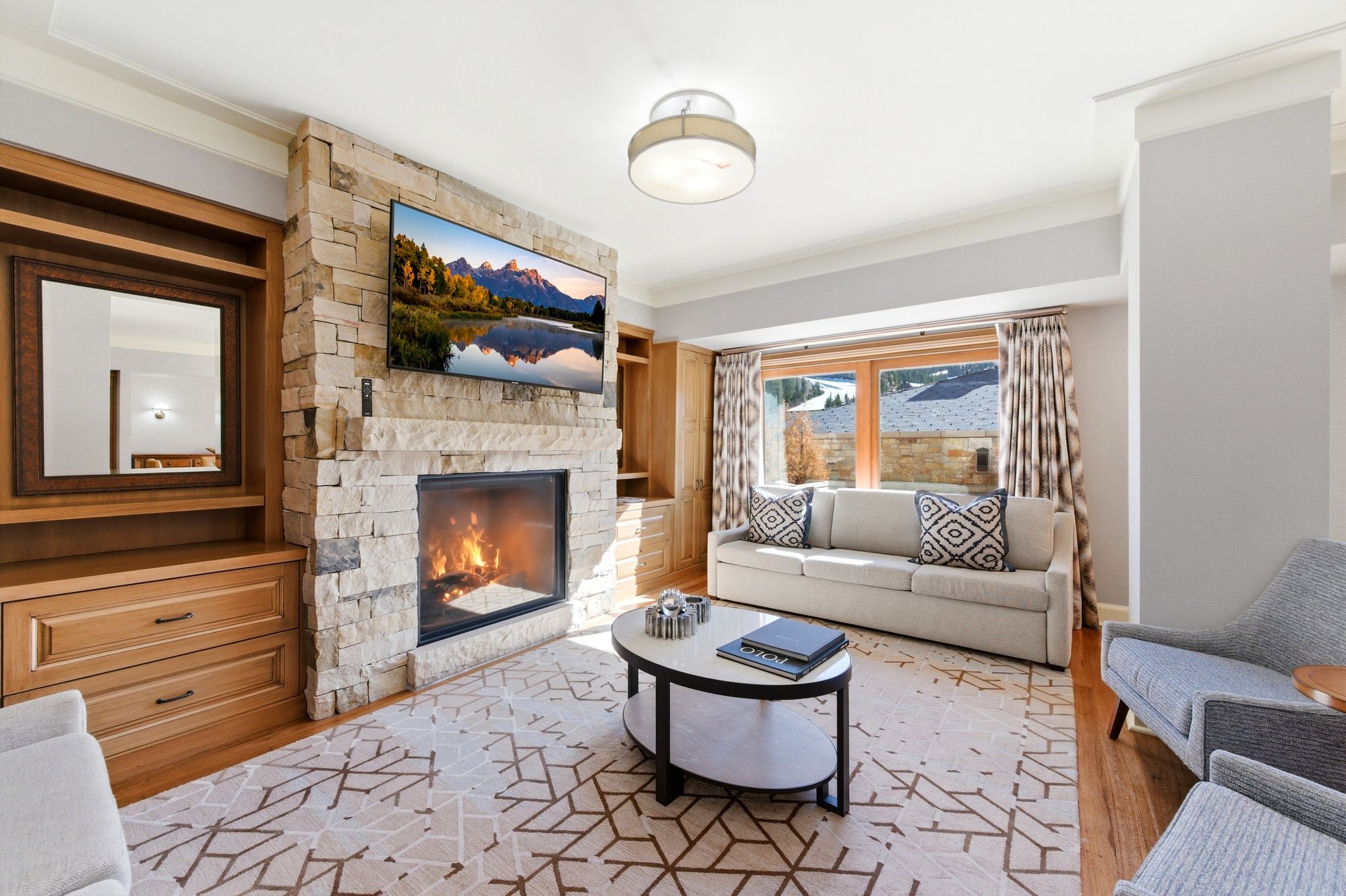 Stone-clad fireplace with a built-in media center