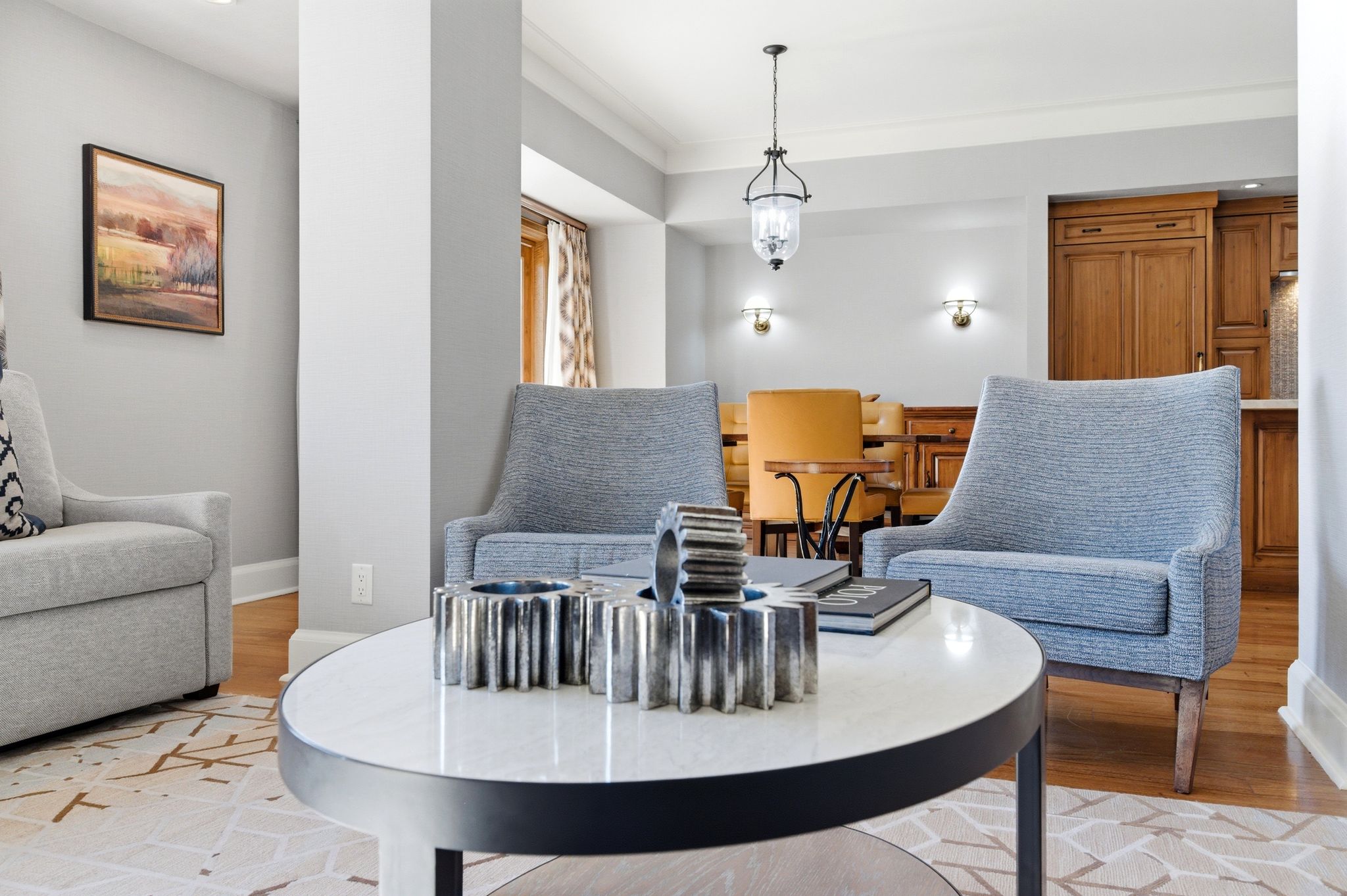 Living area featuring hardwood flooring, recessed lighting, and crown molding