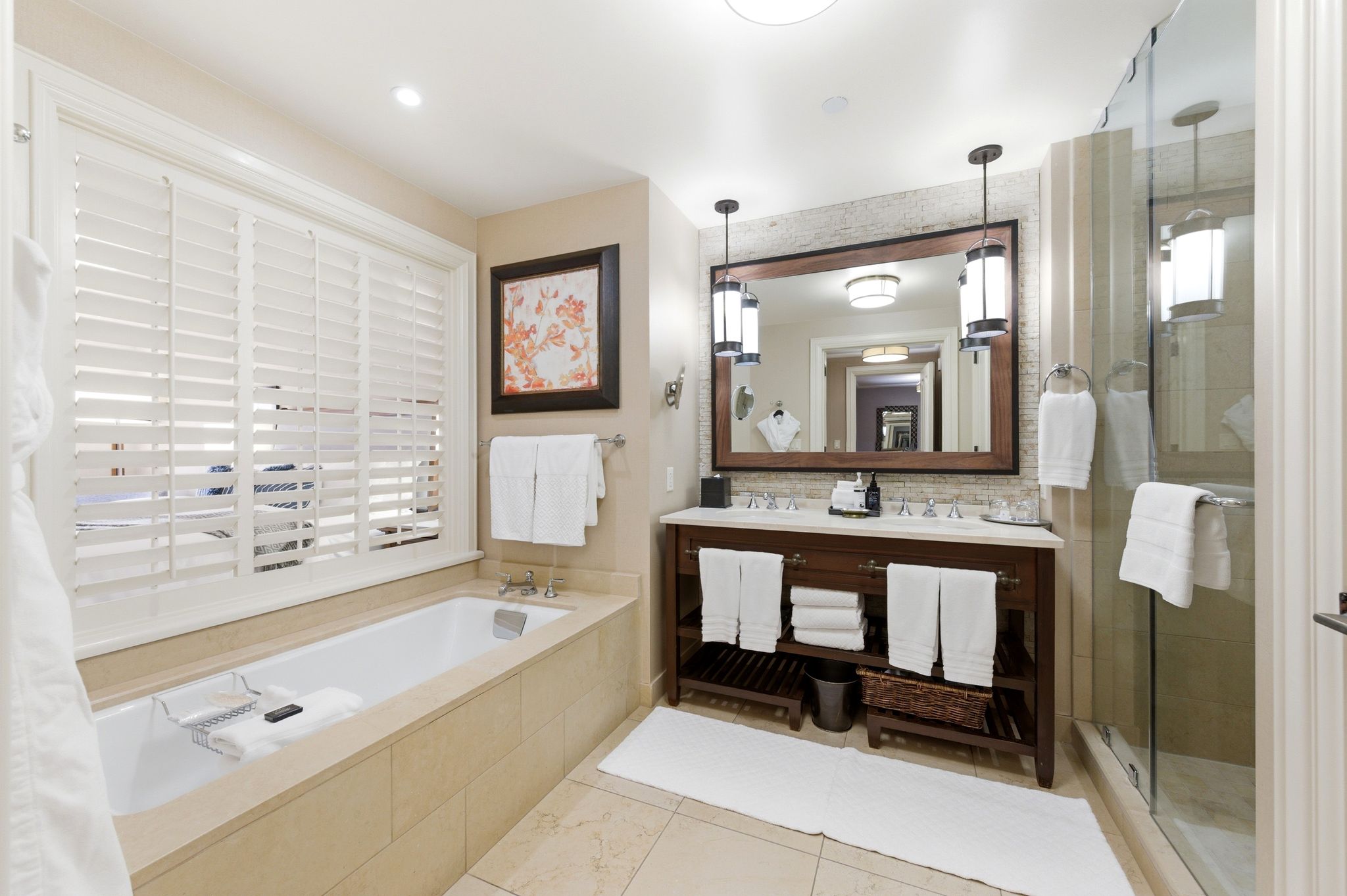 Bathroom featuring a built-in soaking tub with white plantation shutters