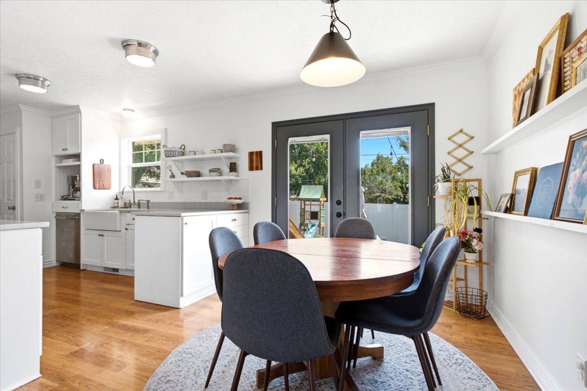 Wood-finish flooring throughout the dining area and kitchen