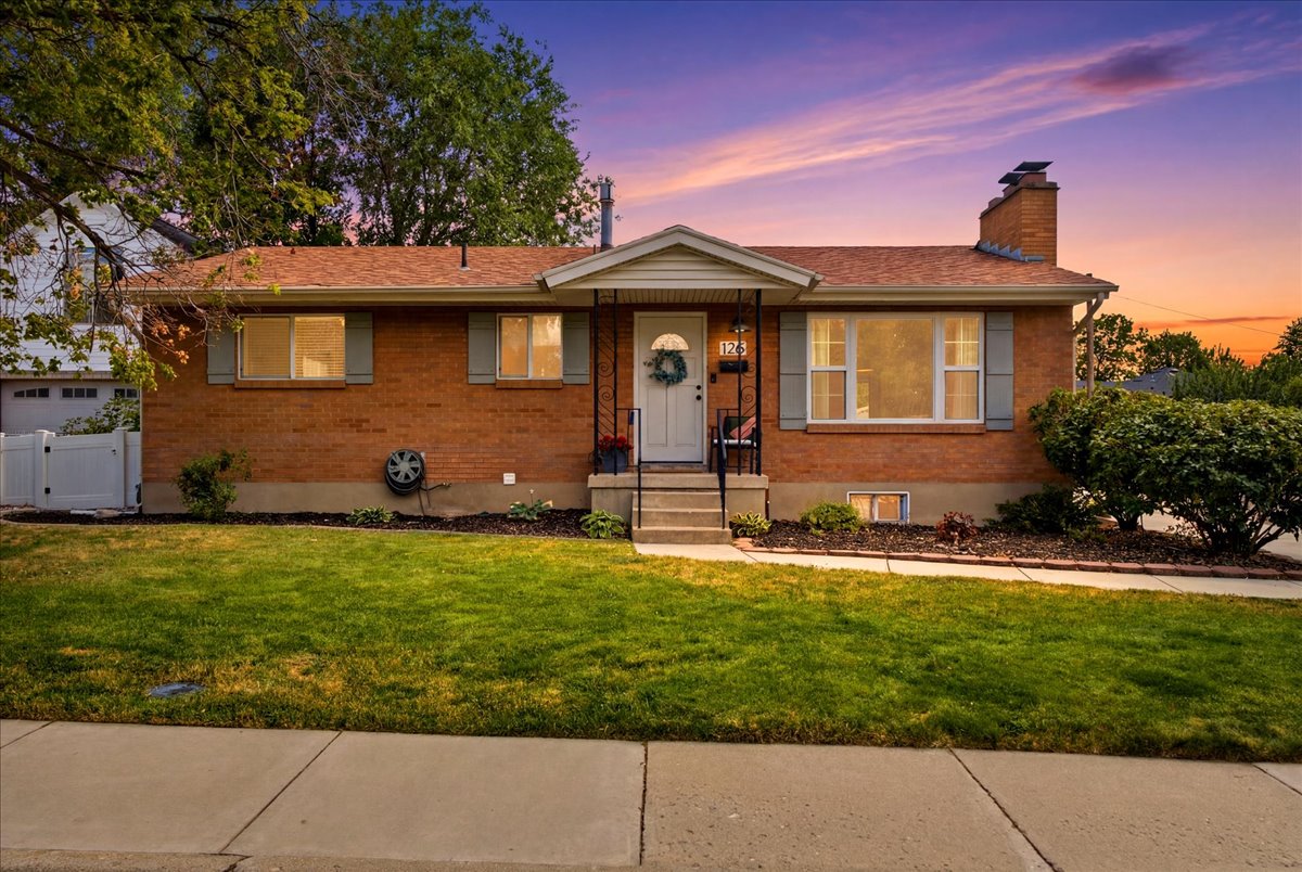 Brick exterior with a covered porch entry
