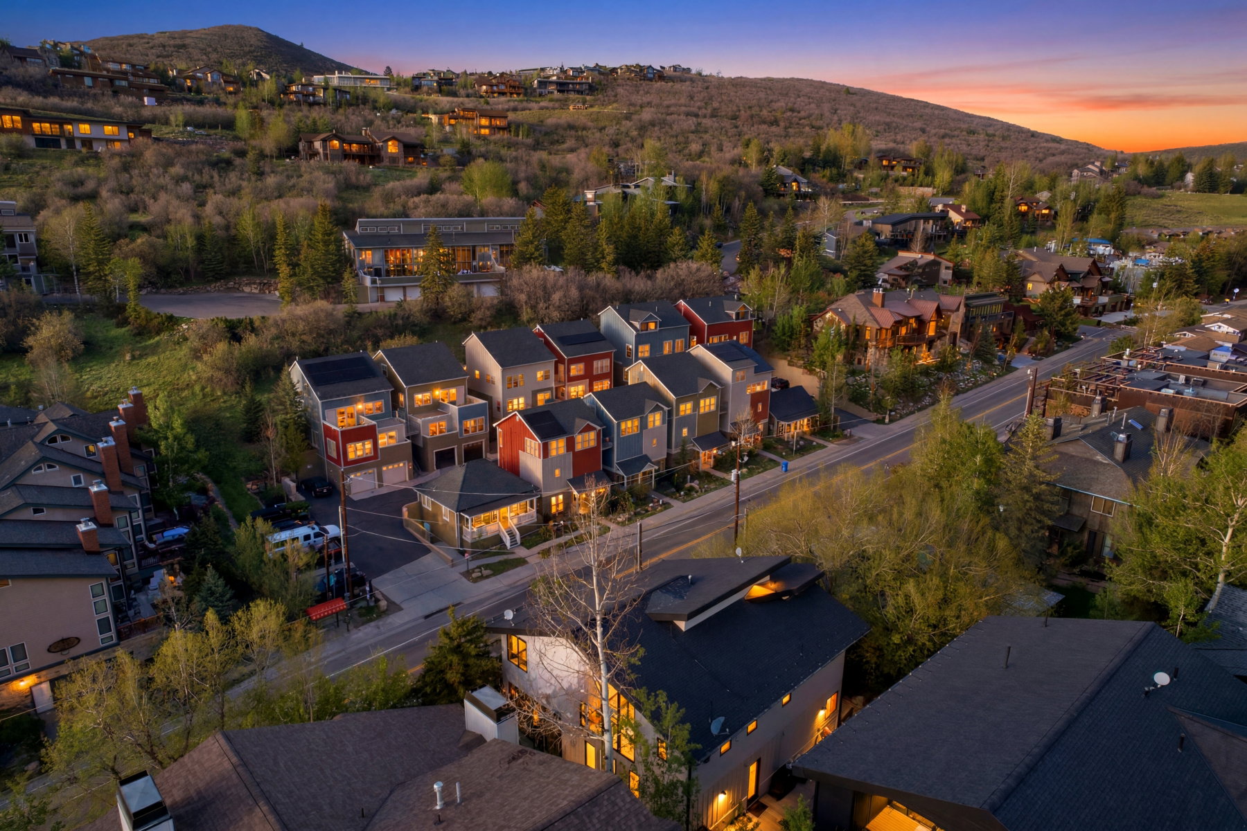 Modern townhomes featuring varied exterior finishes and attached garages