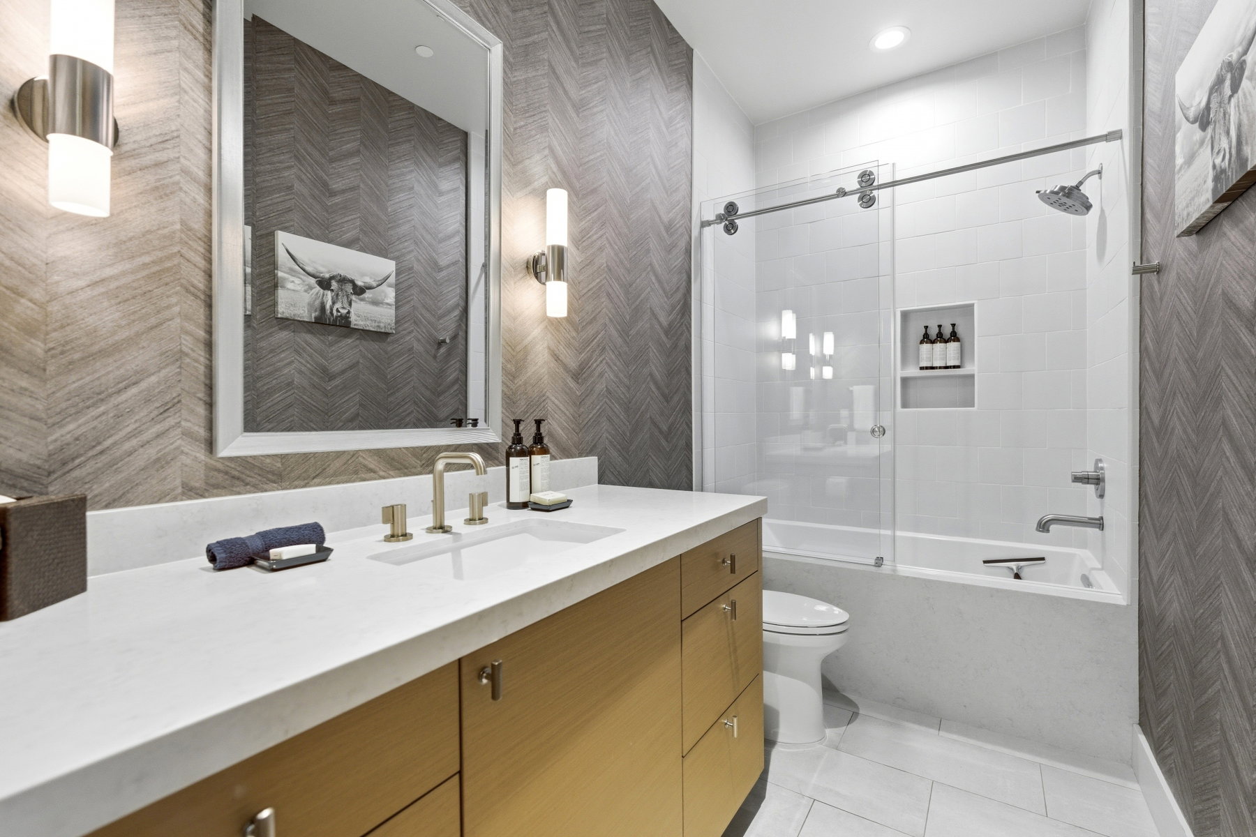 Bathroom featuring a single vanity with light-toned cabinetry and a white countertop