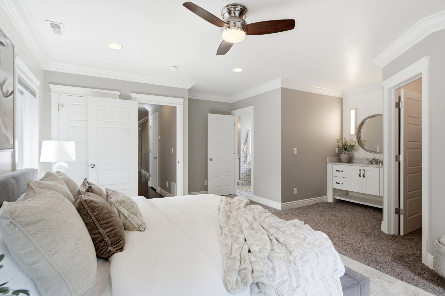 Spacious bedroom featuring crown molding, recessed lighting, and a ceiling fan