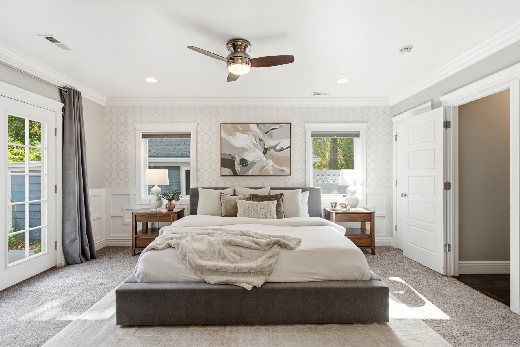 Carpeted bedroom with a ceiling fan, recessed lighting, and crown molding