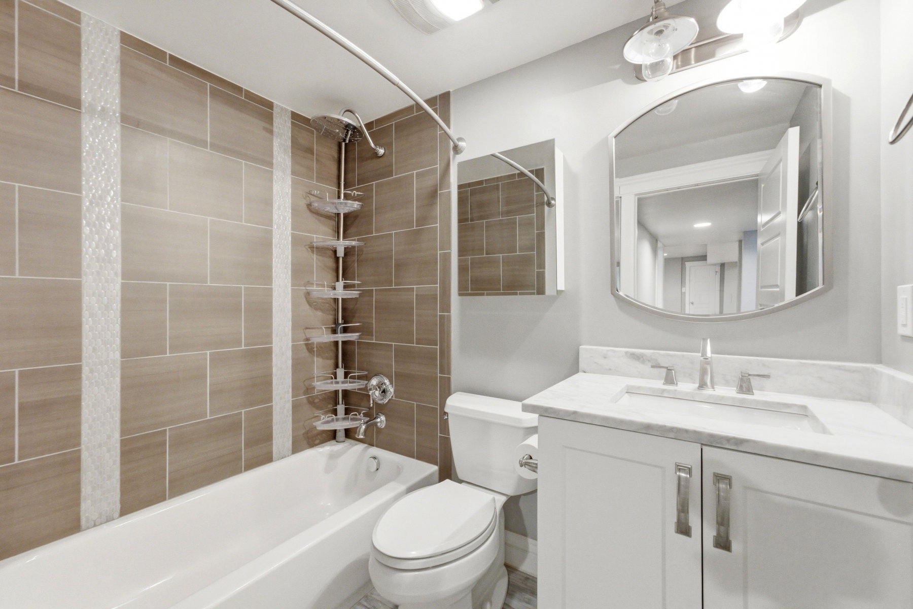 Contemporary bathroom with light gray walls and recessed lighting