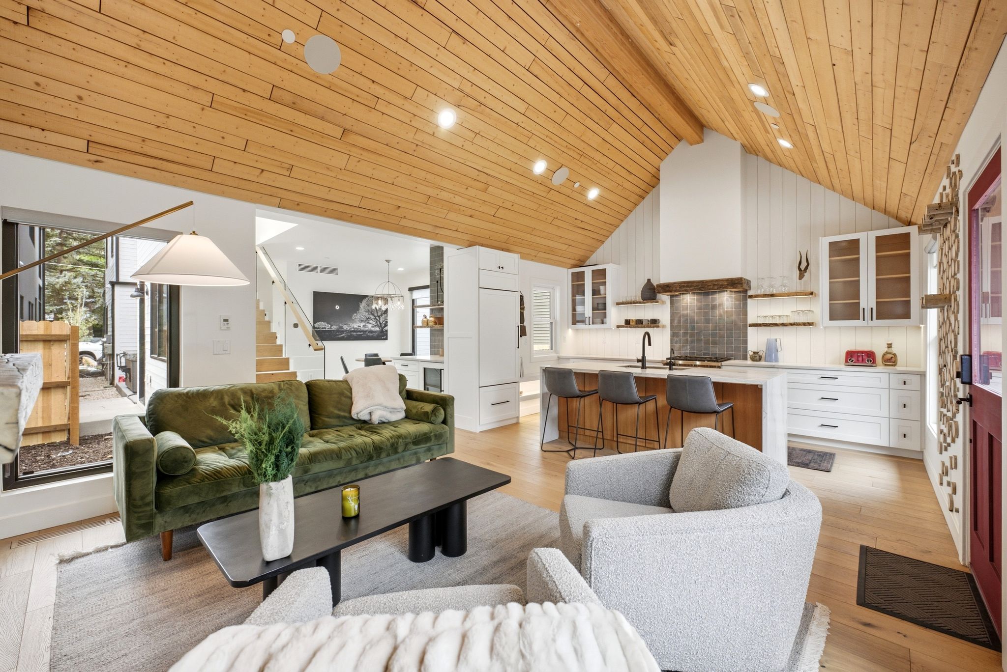 Vaulted wood-plank ceilings spanning an open-concept living area and kitchen