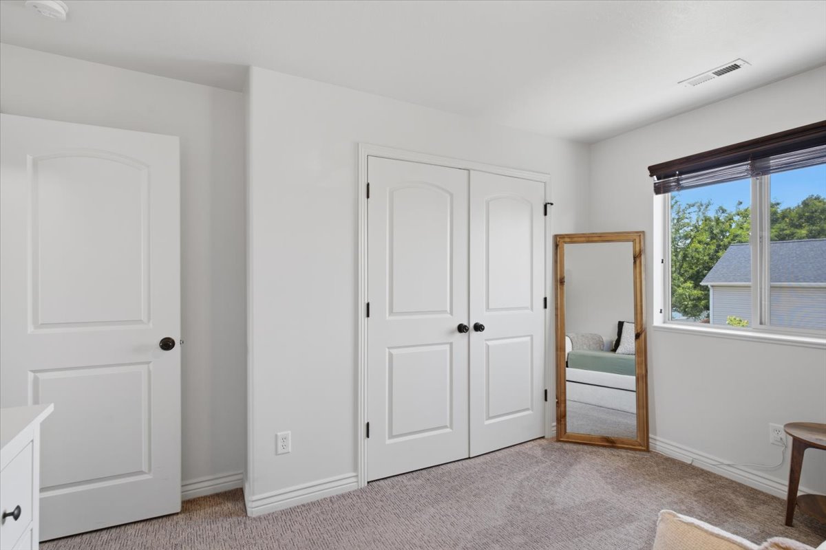 White paneled doors with matte black hardware