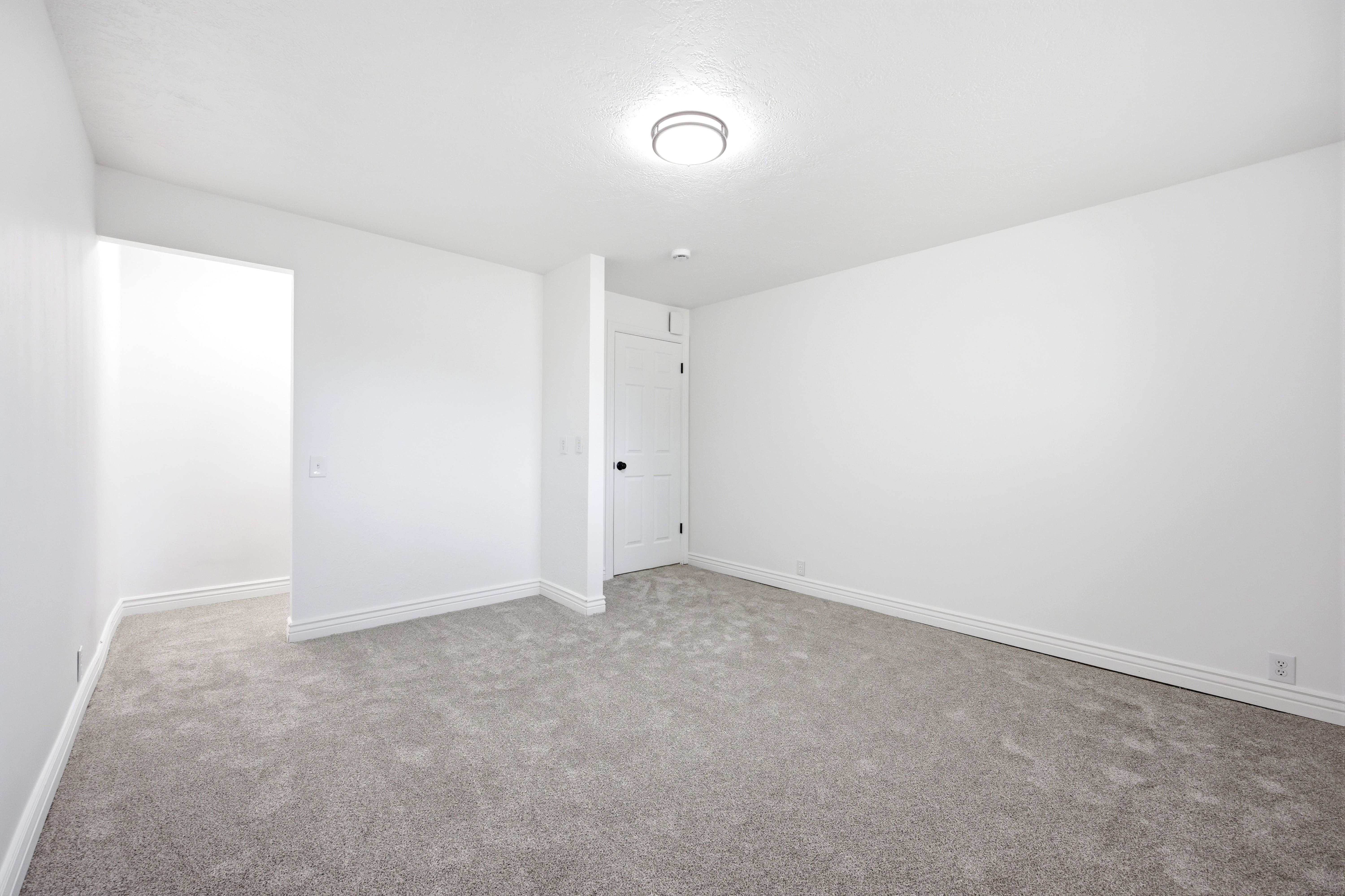 Neutral-toned carpeting throughout