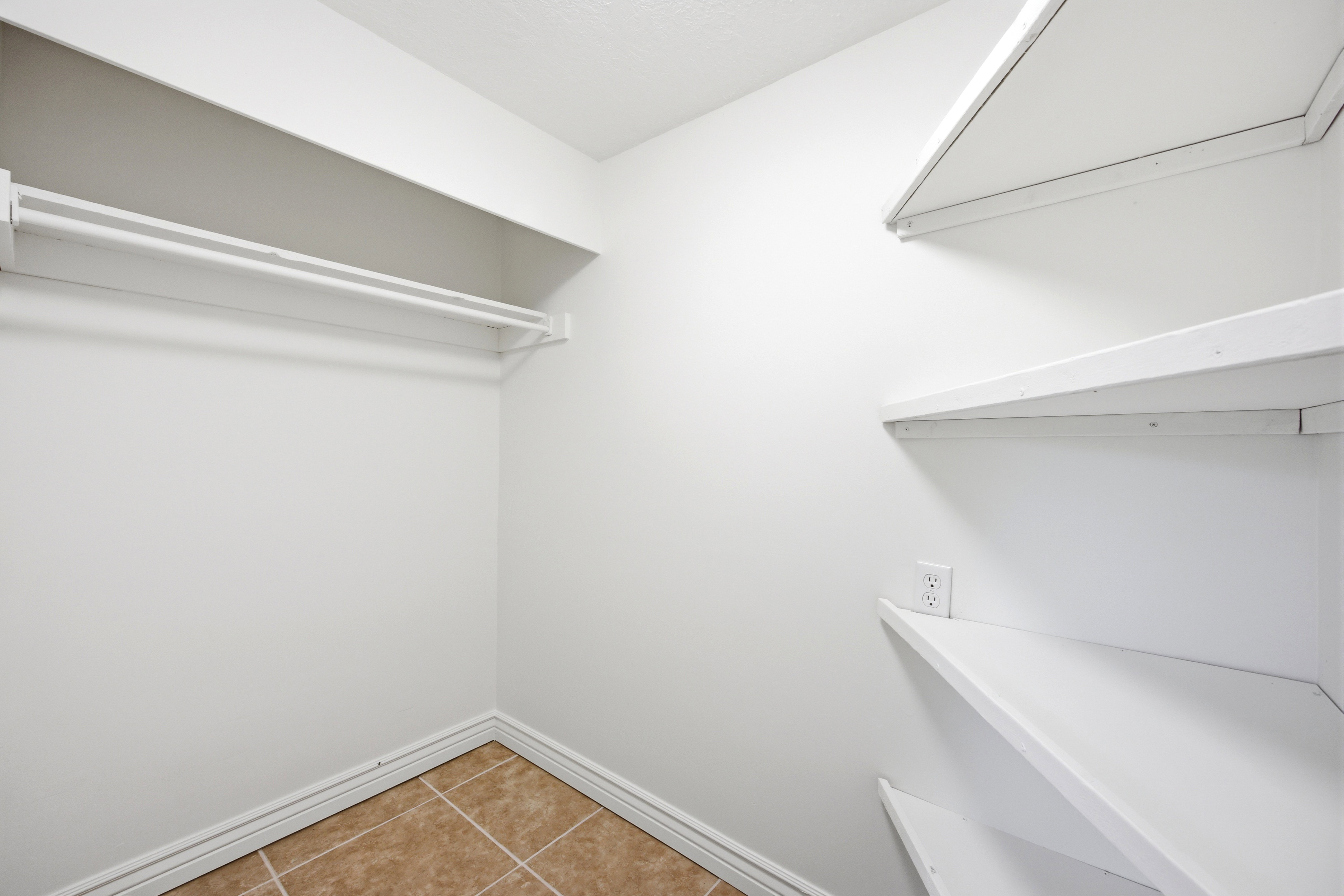 White interior with integrated shelving and hanging rod