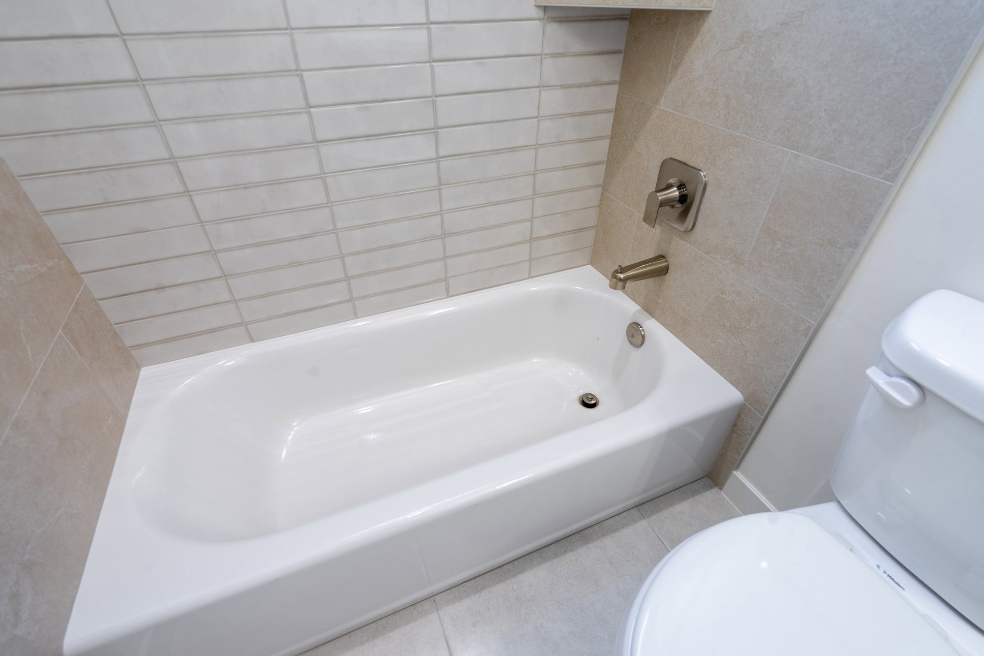 Bathroom featuring toilet and light tile patterned floors