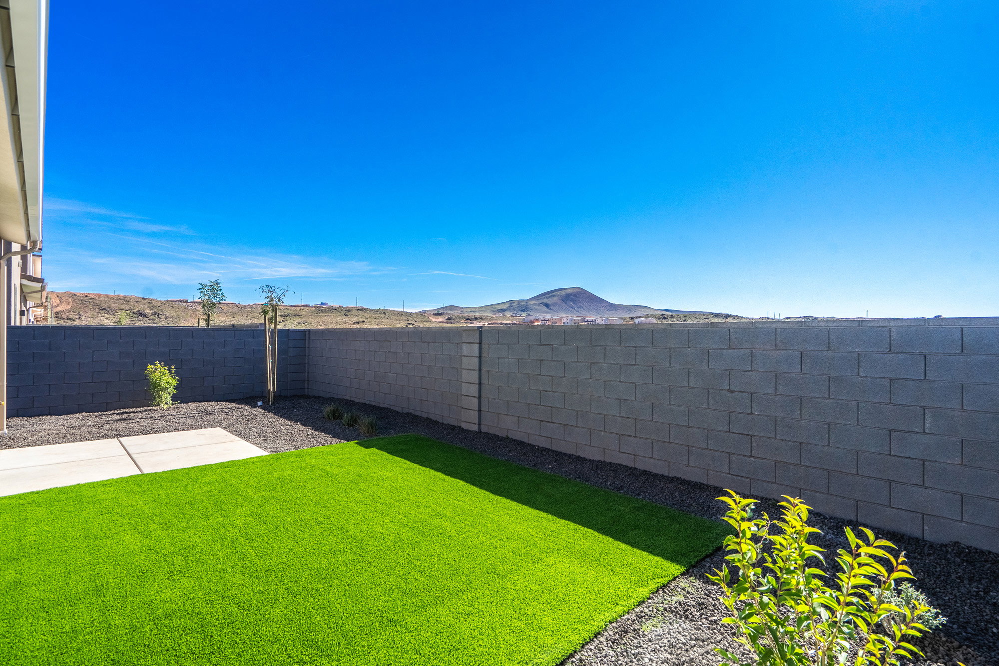 Fenced backyard featuring a mountain view