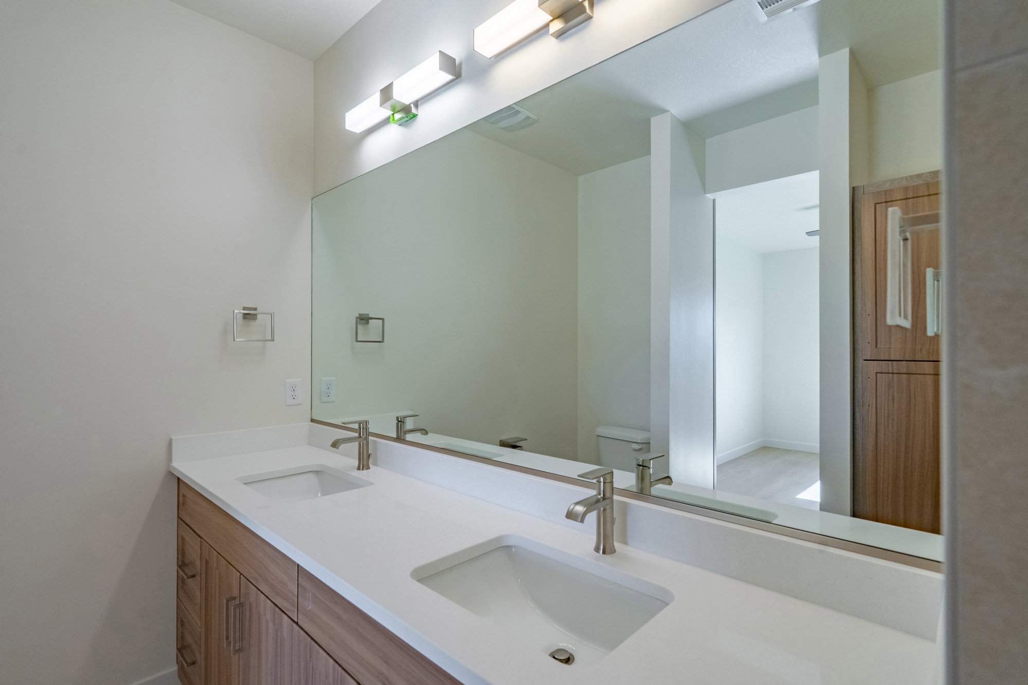 Bathroom with toilet and double vanity
