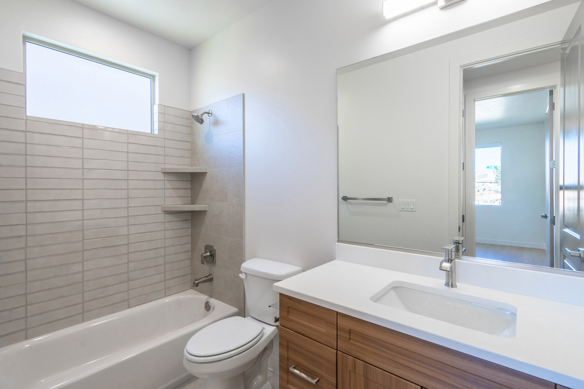Bathroom with vanity and bathing tub / shower combination