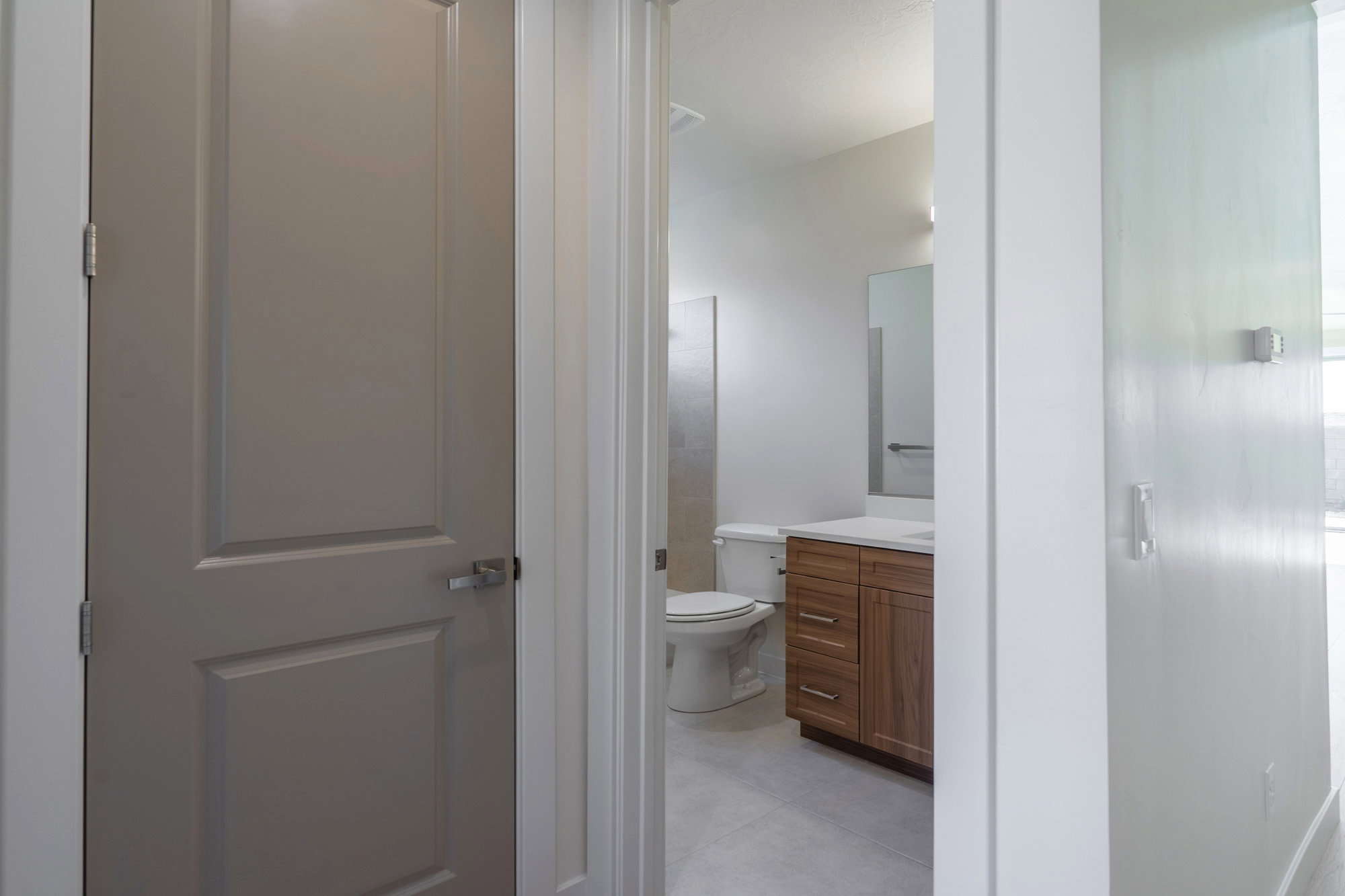 Bathroom featuring vanity and light tile patterned floors