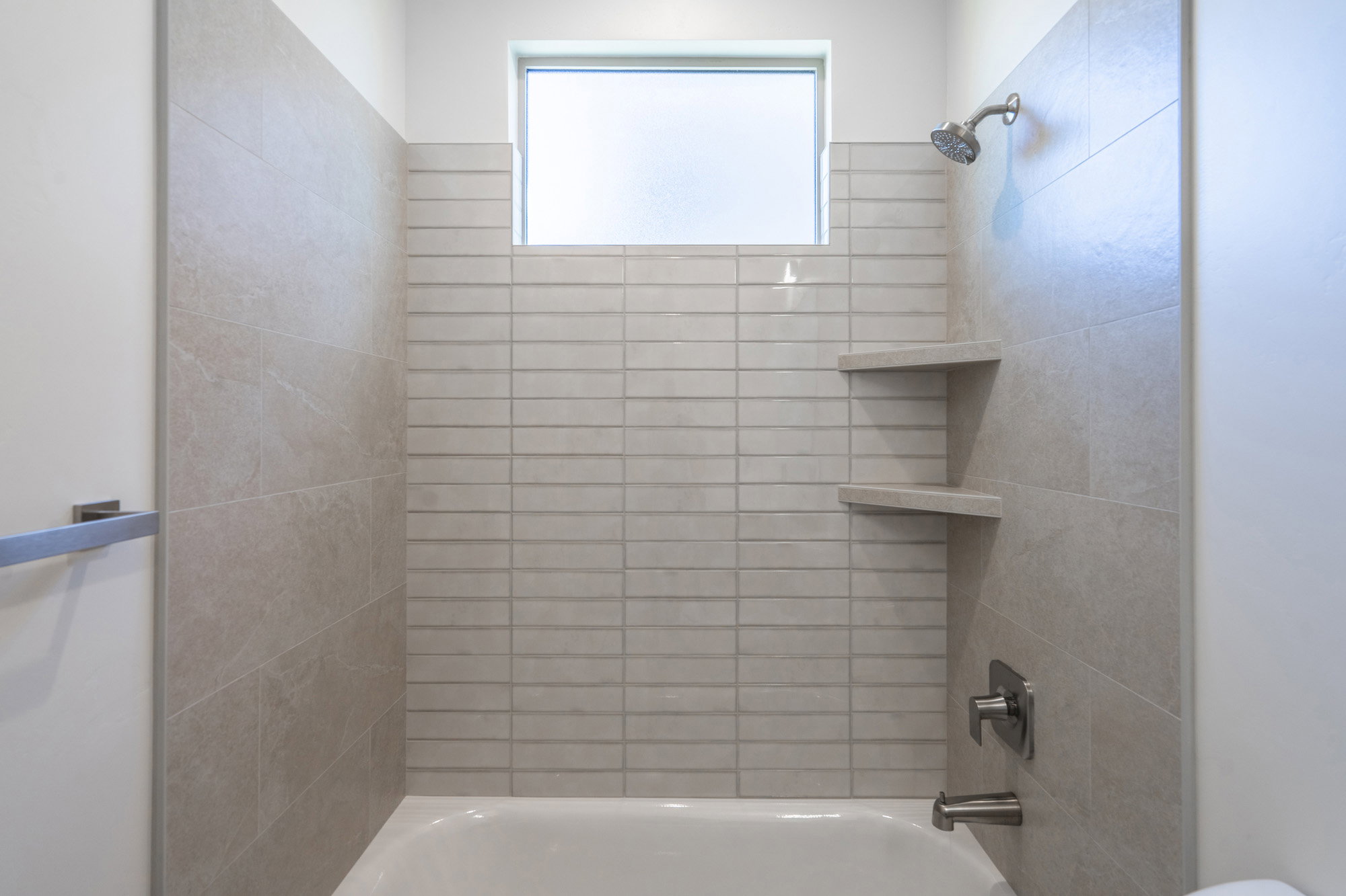 Full bath featuring bathing tub / shower combination