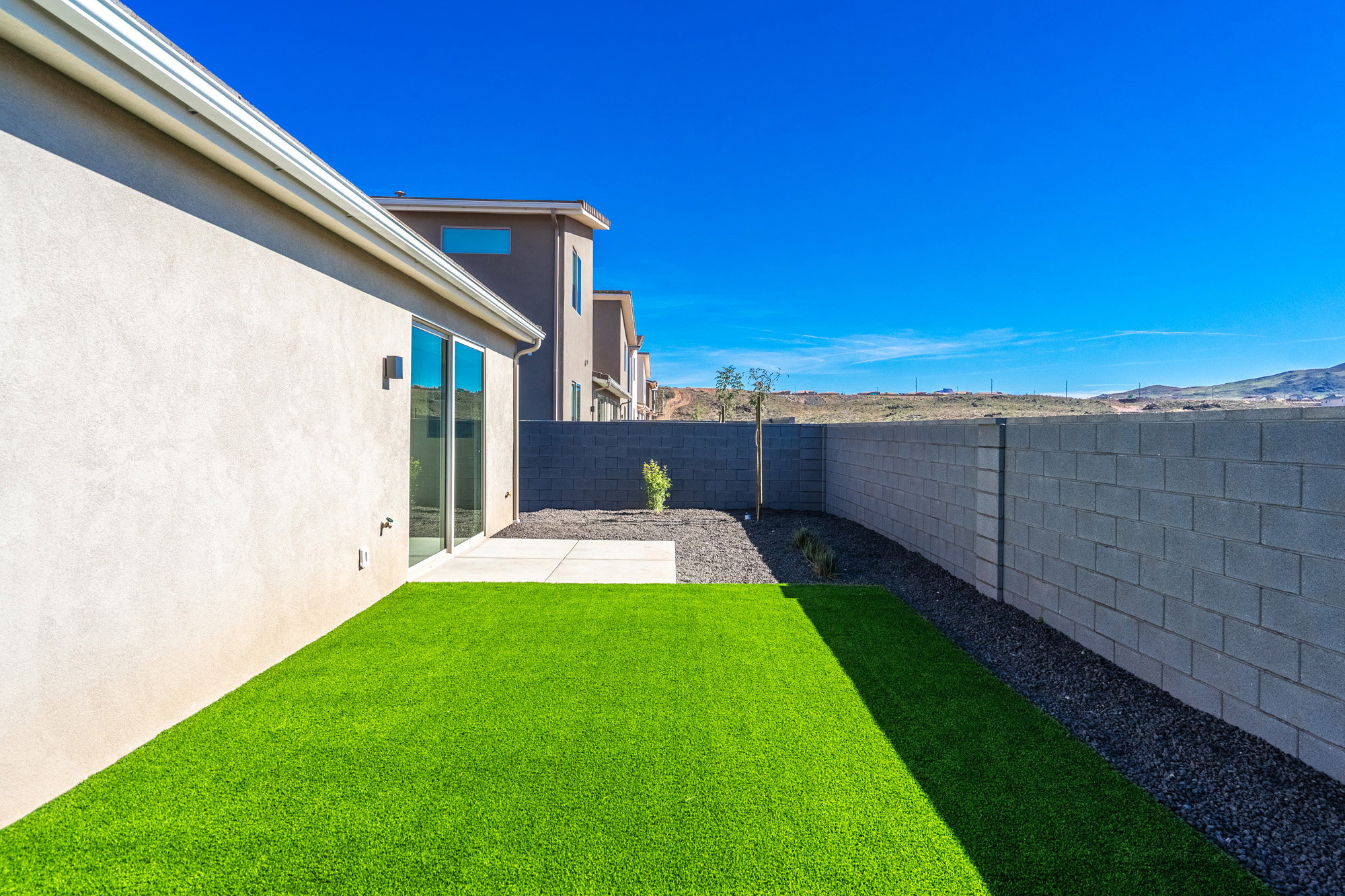 View of fenced backyard