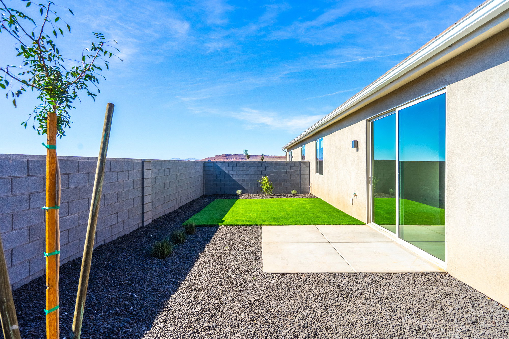 Fenced backyard featuring a patio