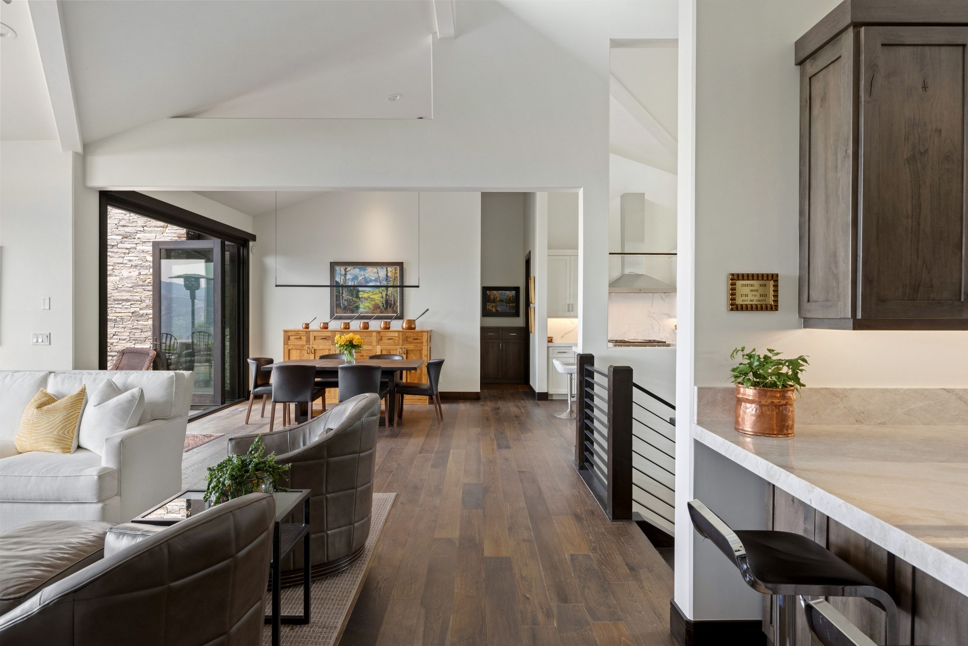 Spacious interior with vaulted ceilings and wood-finish flooring