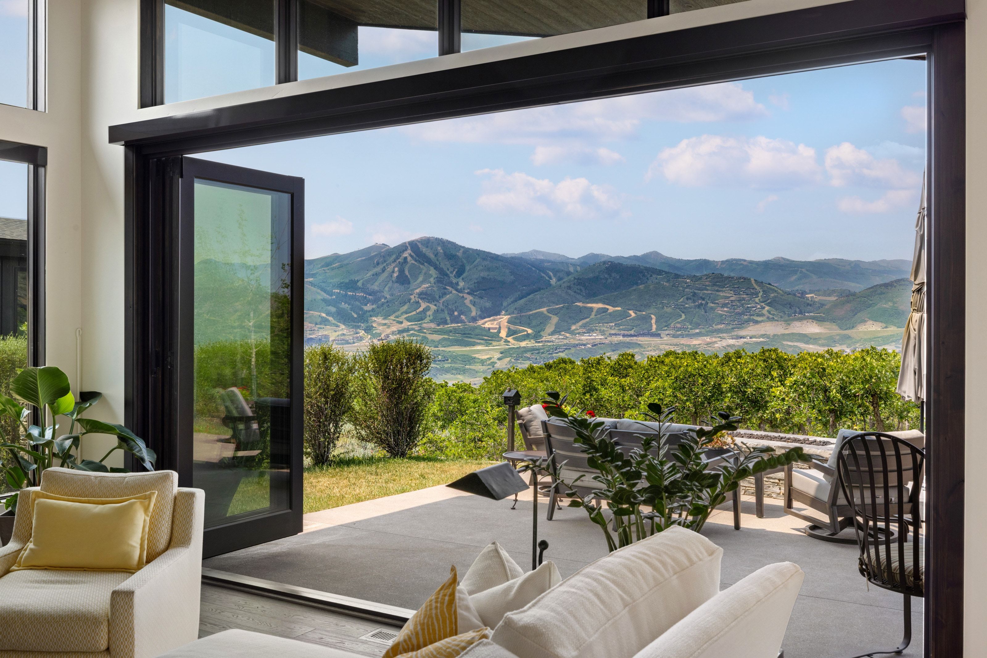 Expansive outdoor patio featuring mountain scenery
