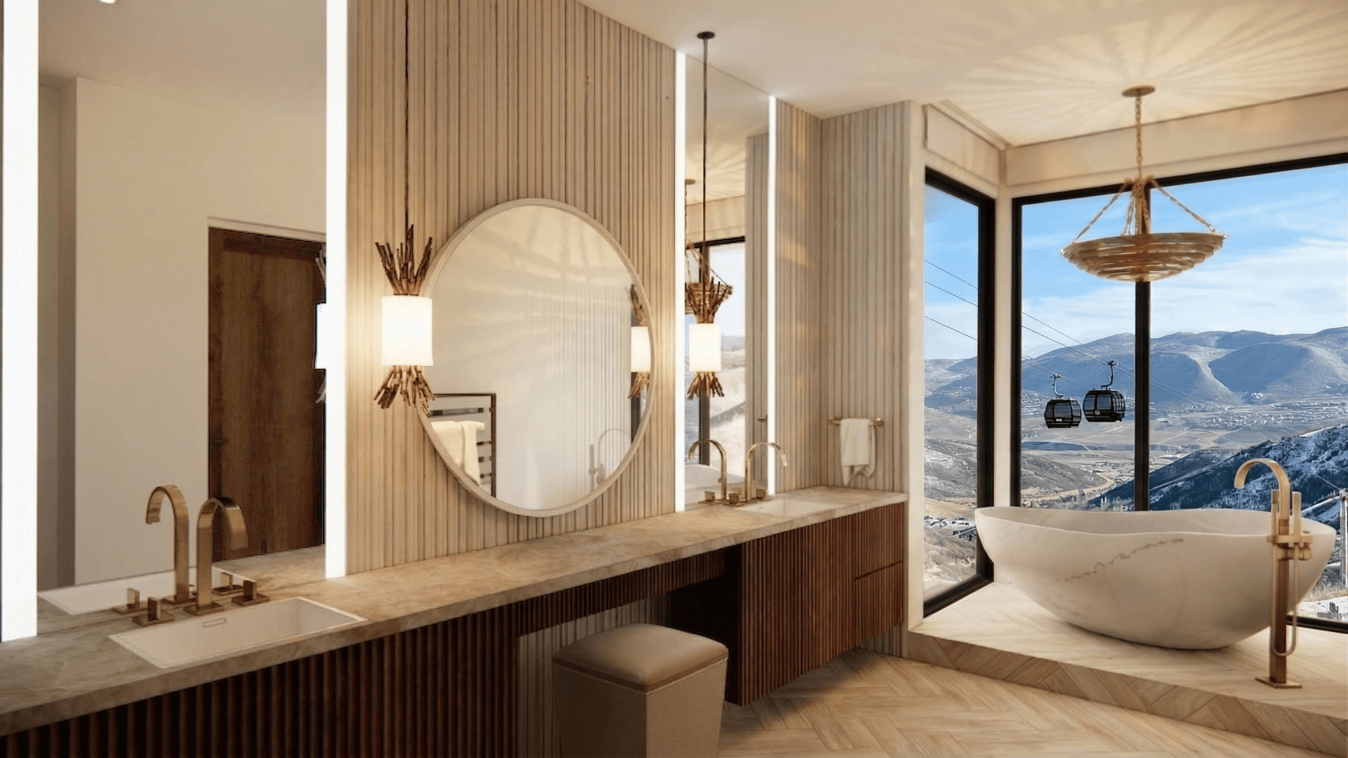 Freestanding soaking tub with a floor-mounted gold-tone faucet, set against expansive windows overlooking a mountain landscape