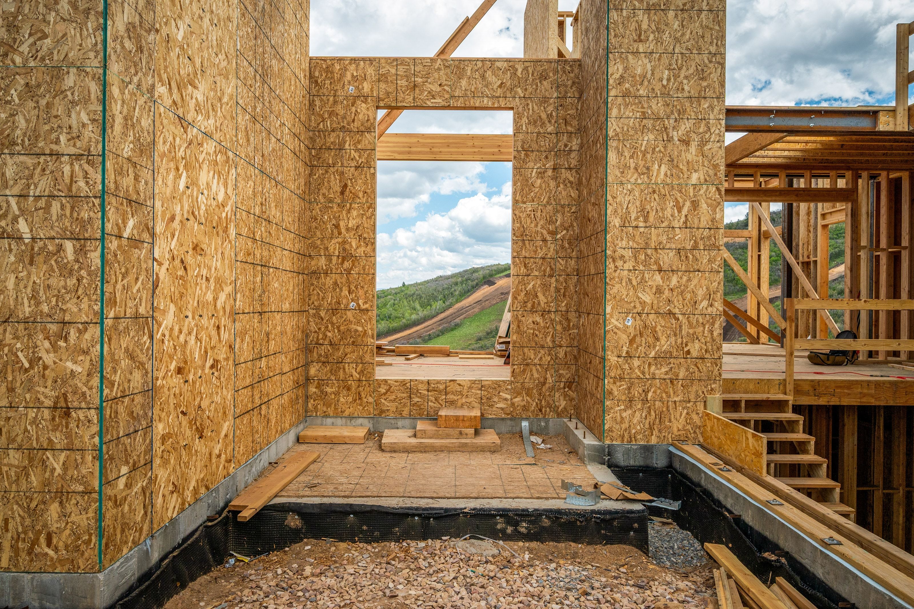 Framed structural walls with exterior sheathing