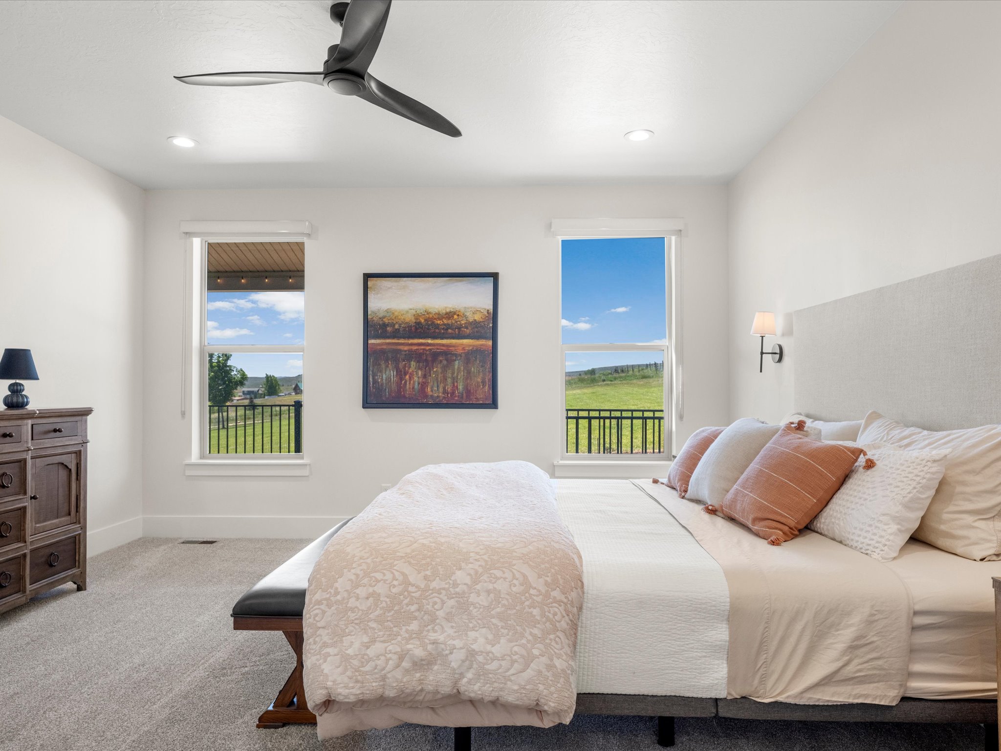 Bedroom featuring recessed lighting, a modern ceiling fan, and two windows