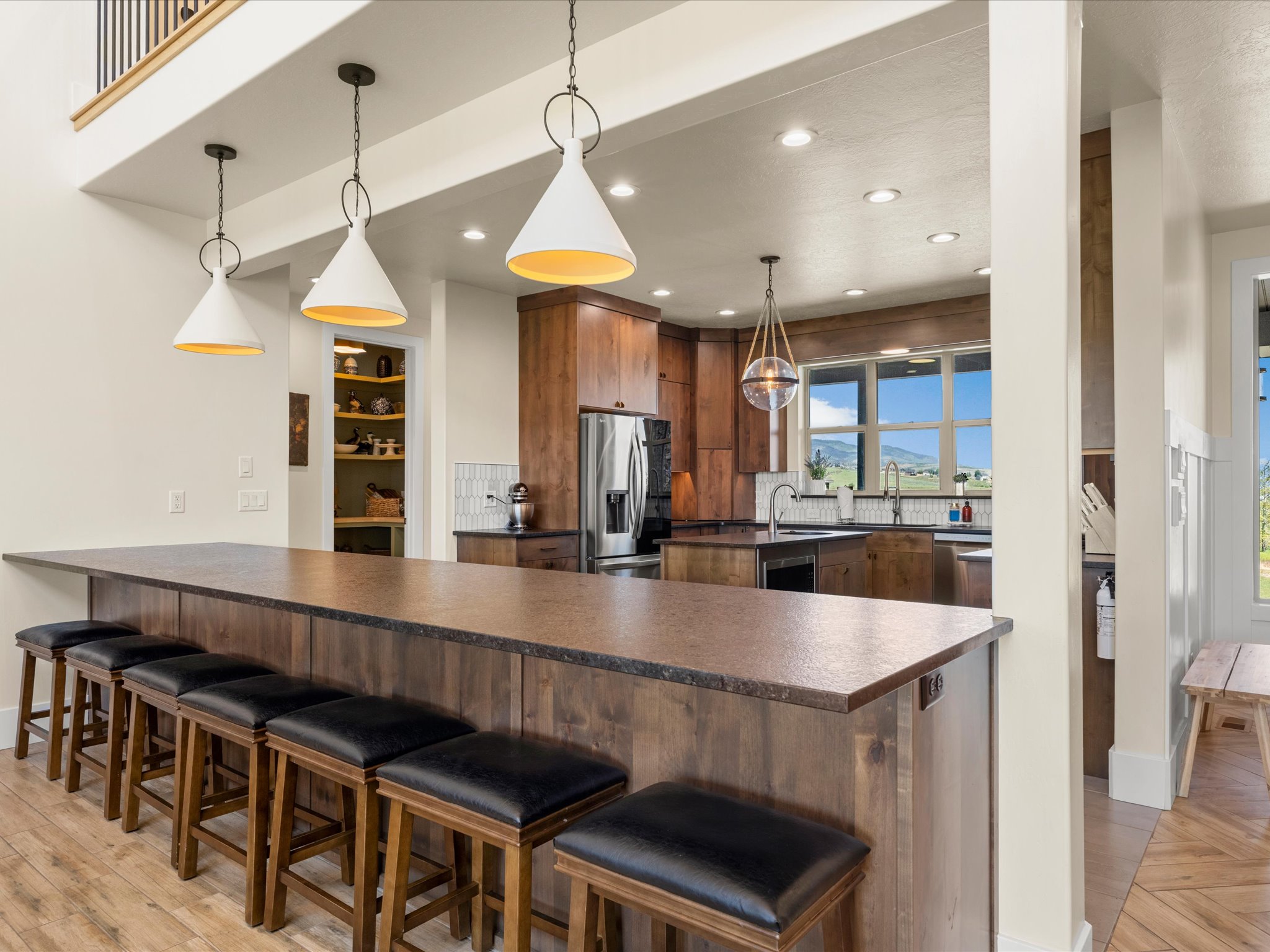 Spacious kitchen island featuring a durable countertop and integrated seating